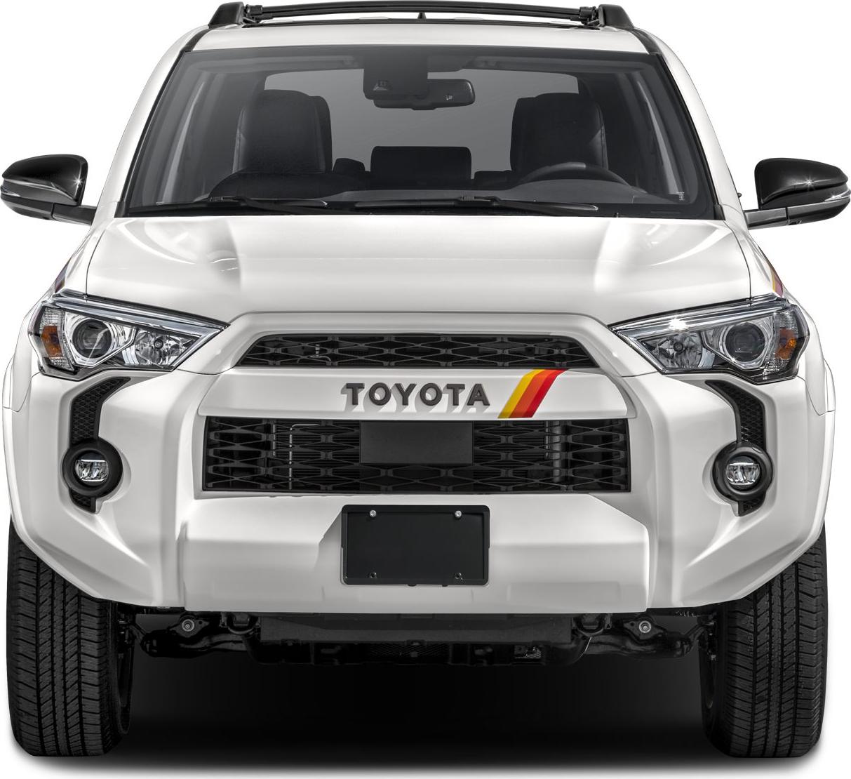 Bold front grille with integrated headlights and roof rack on white SUV.