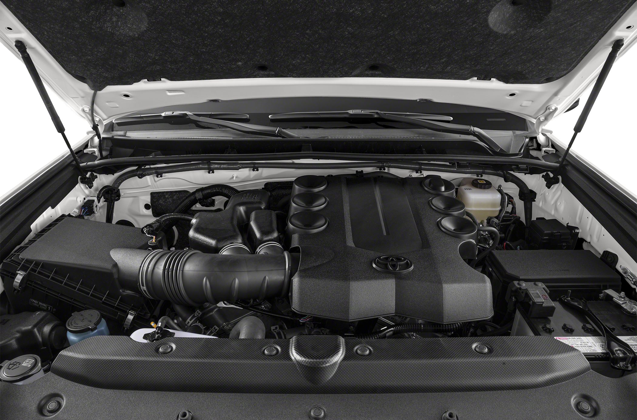 Engine compartment with air intake, battery, and fluid reservoirs