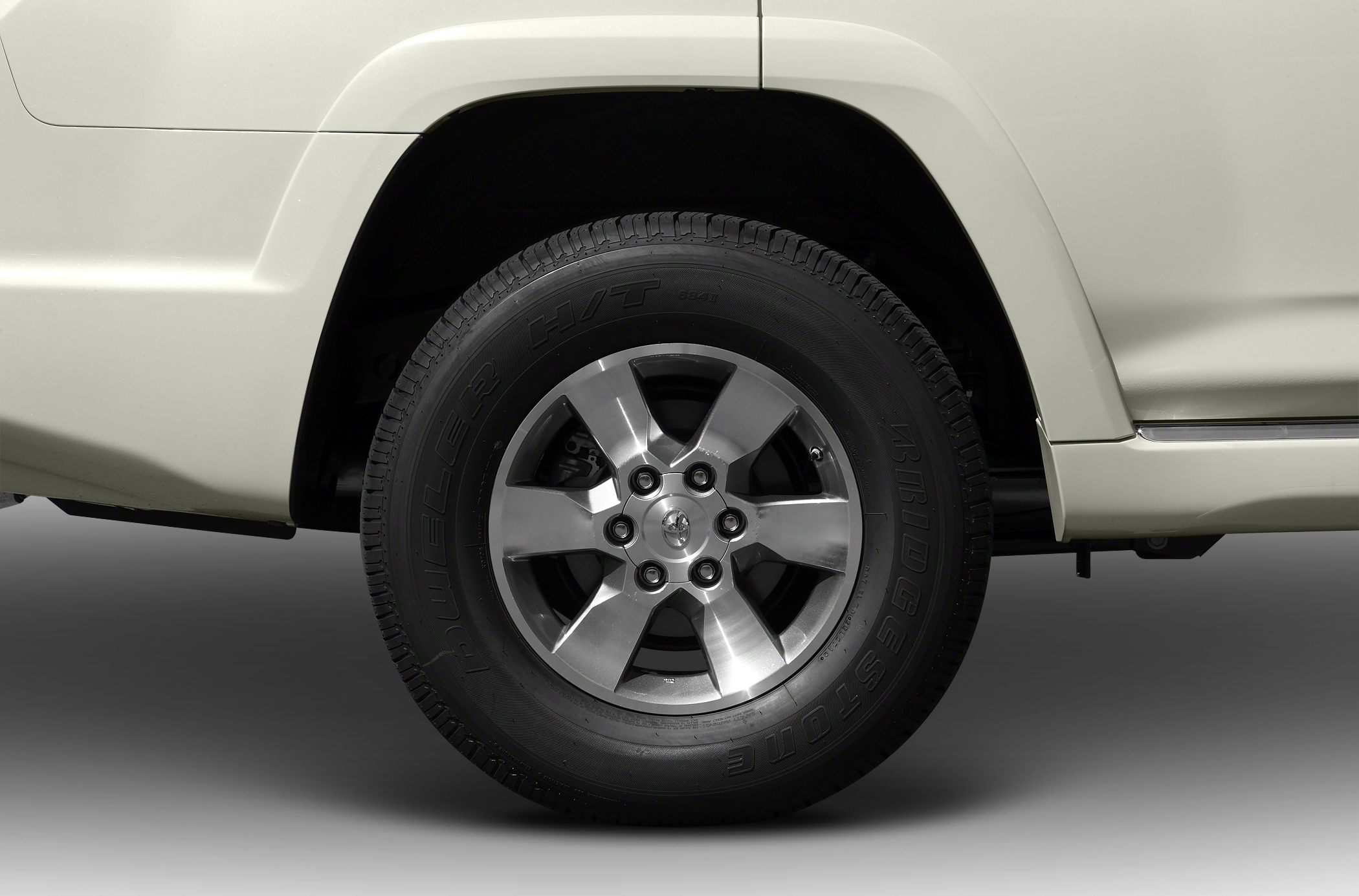 Close-up of alloy wheel and Bridgestone Dueler H/T tire on SUV