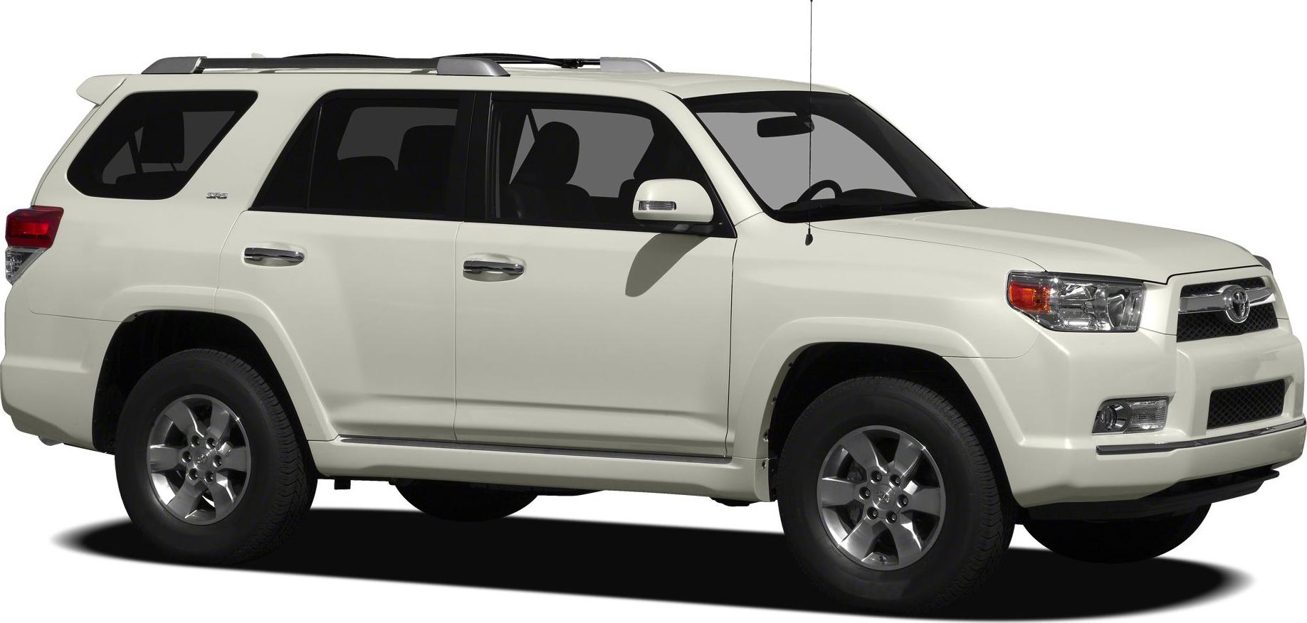 Side view of white SUV with alloy wheels and roof rails