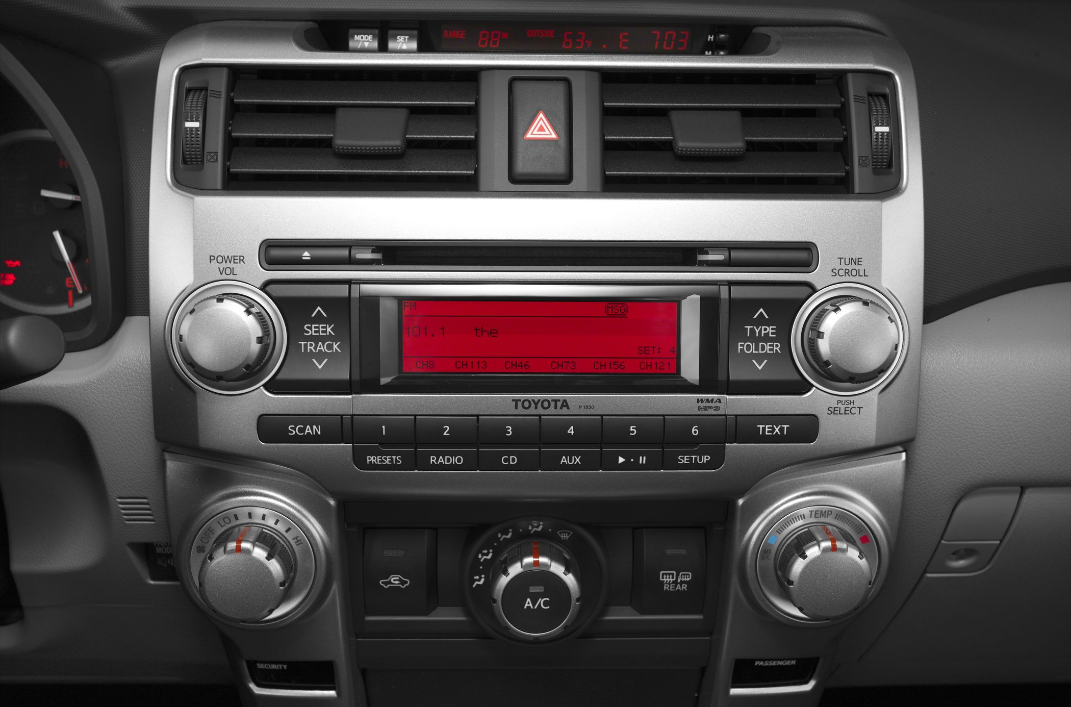 2010 car dashboard with radio system and climate controls