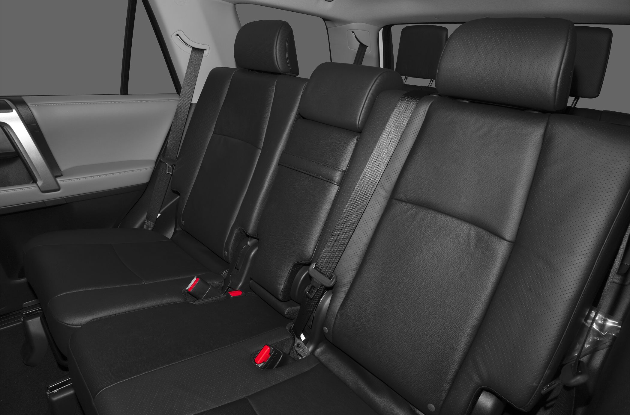 Black leather rear seats with headrests and seatbelts
