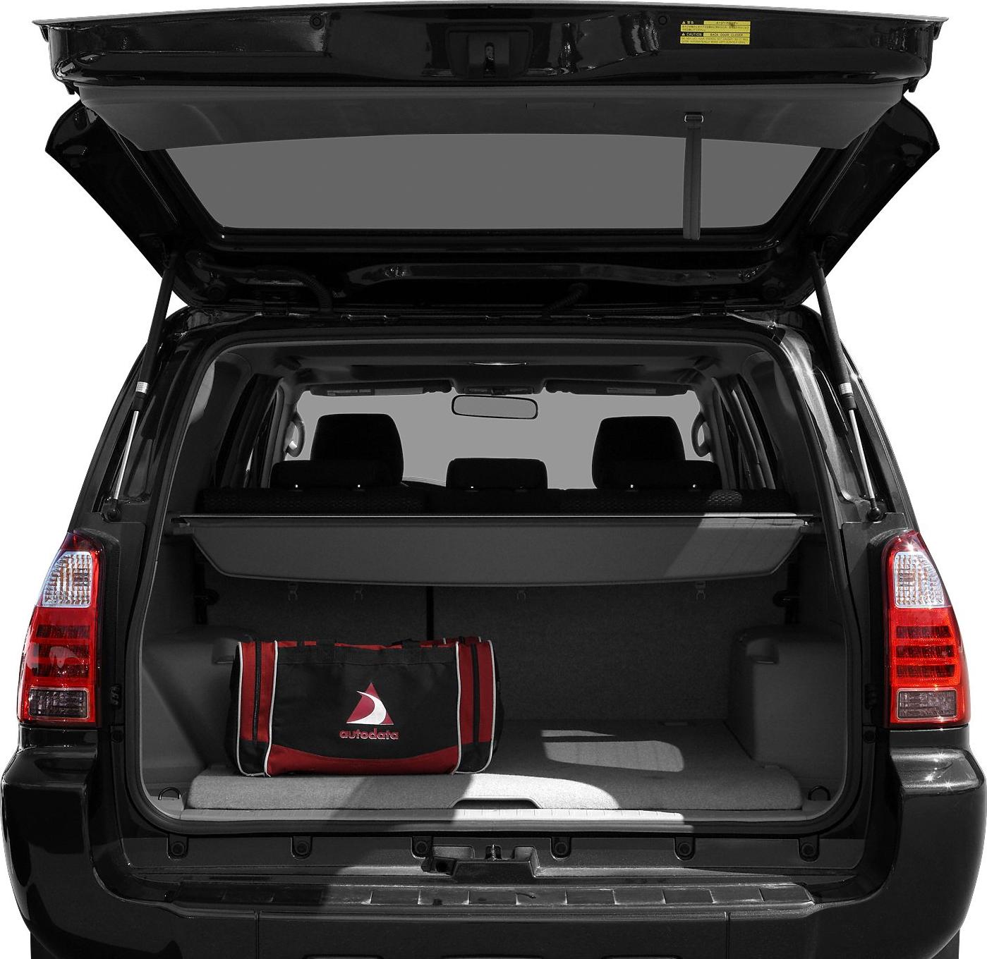 Open SUV trunk with cargo cover and bag inside