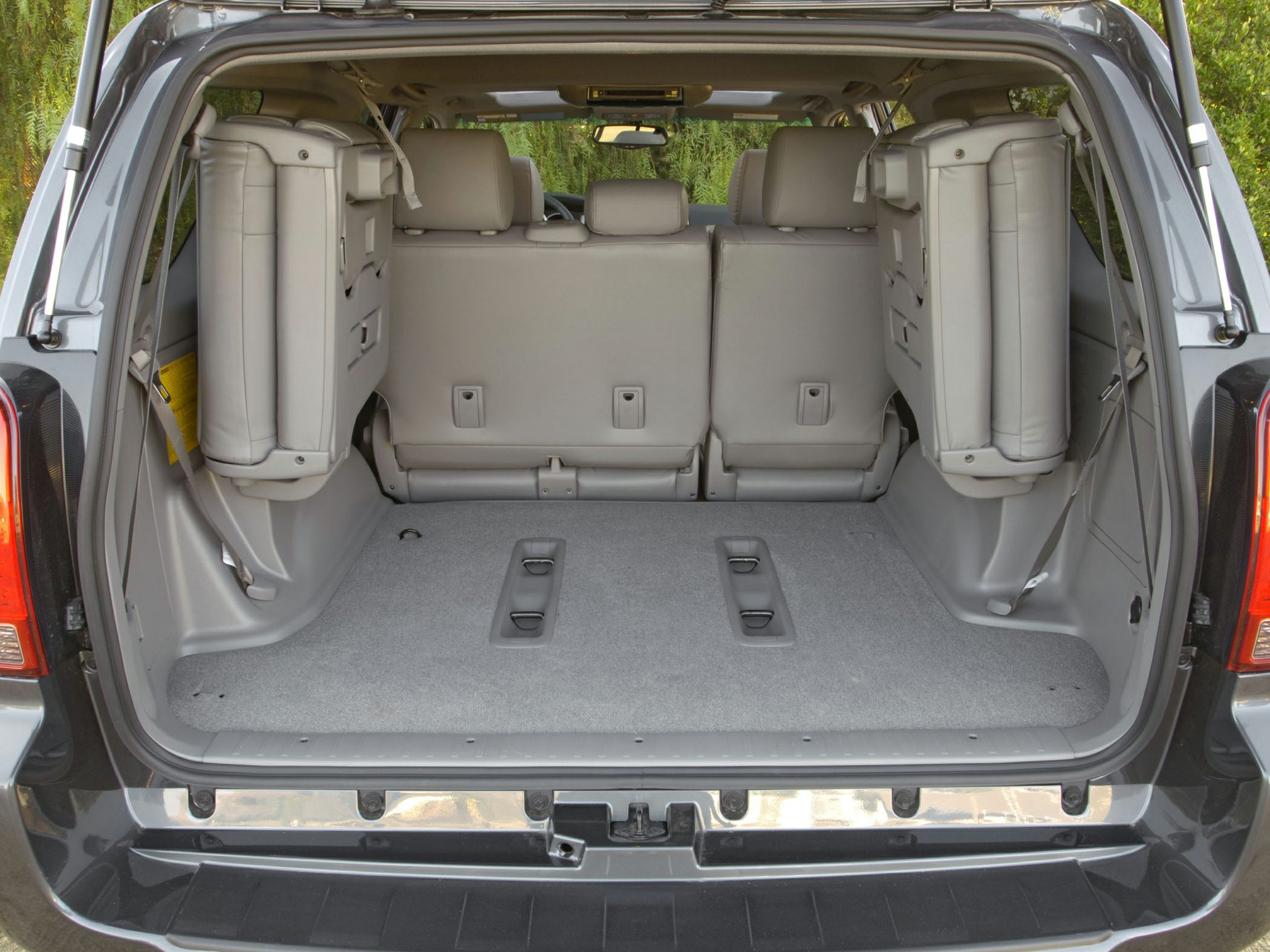 Spacious rear cargo area with fold-up side seats in an SUV