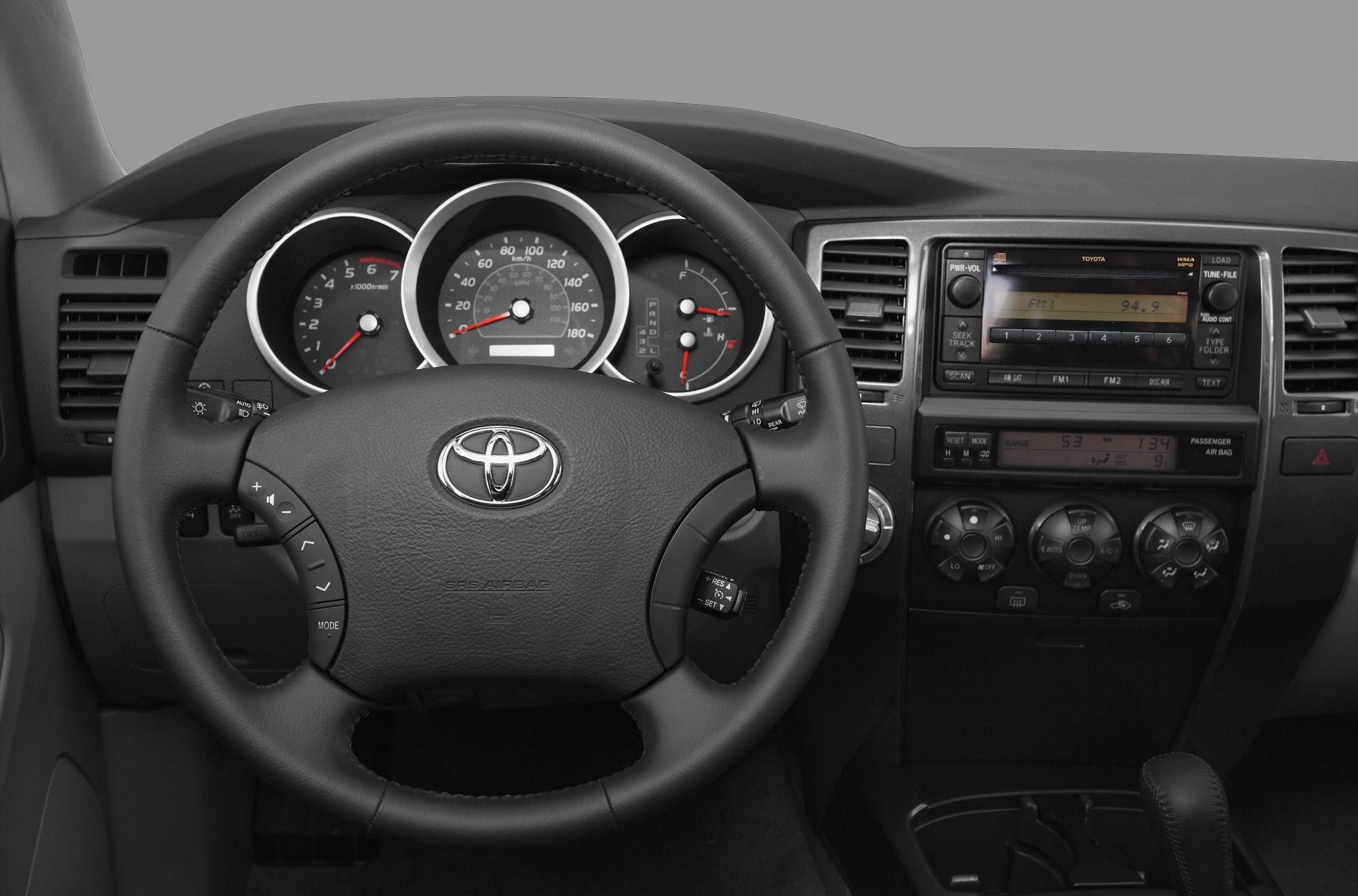 Steering wheel with integrated controls and detailed dashboard layout