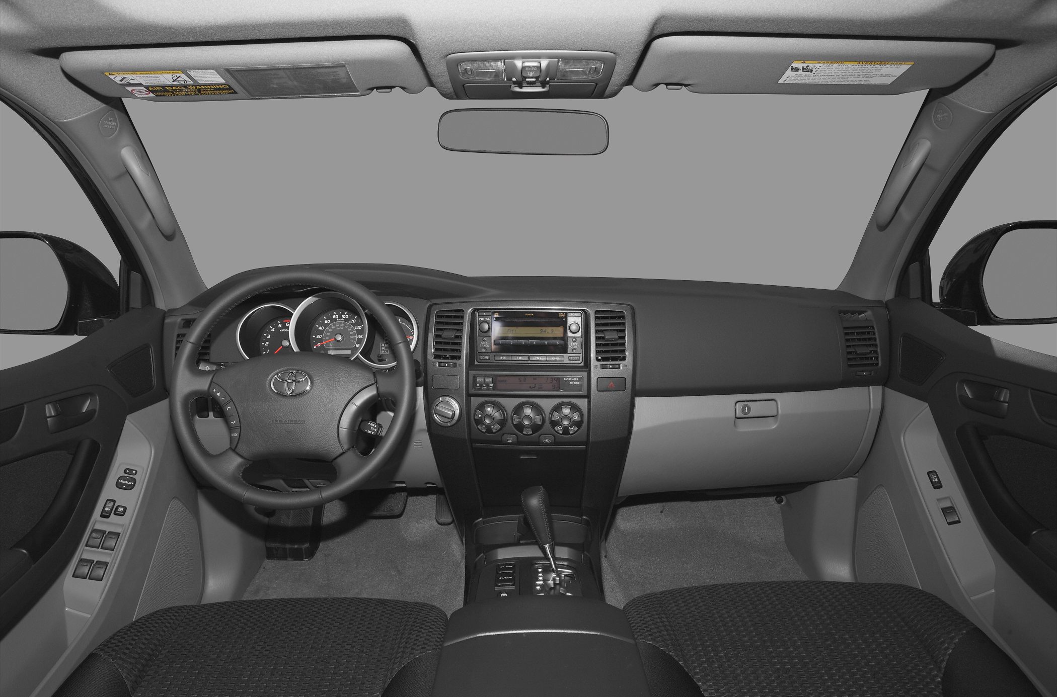 SUV interior dashboard and steering wheel with controls