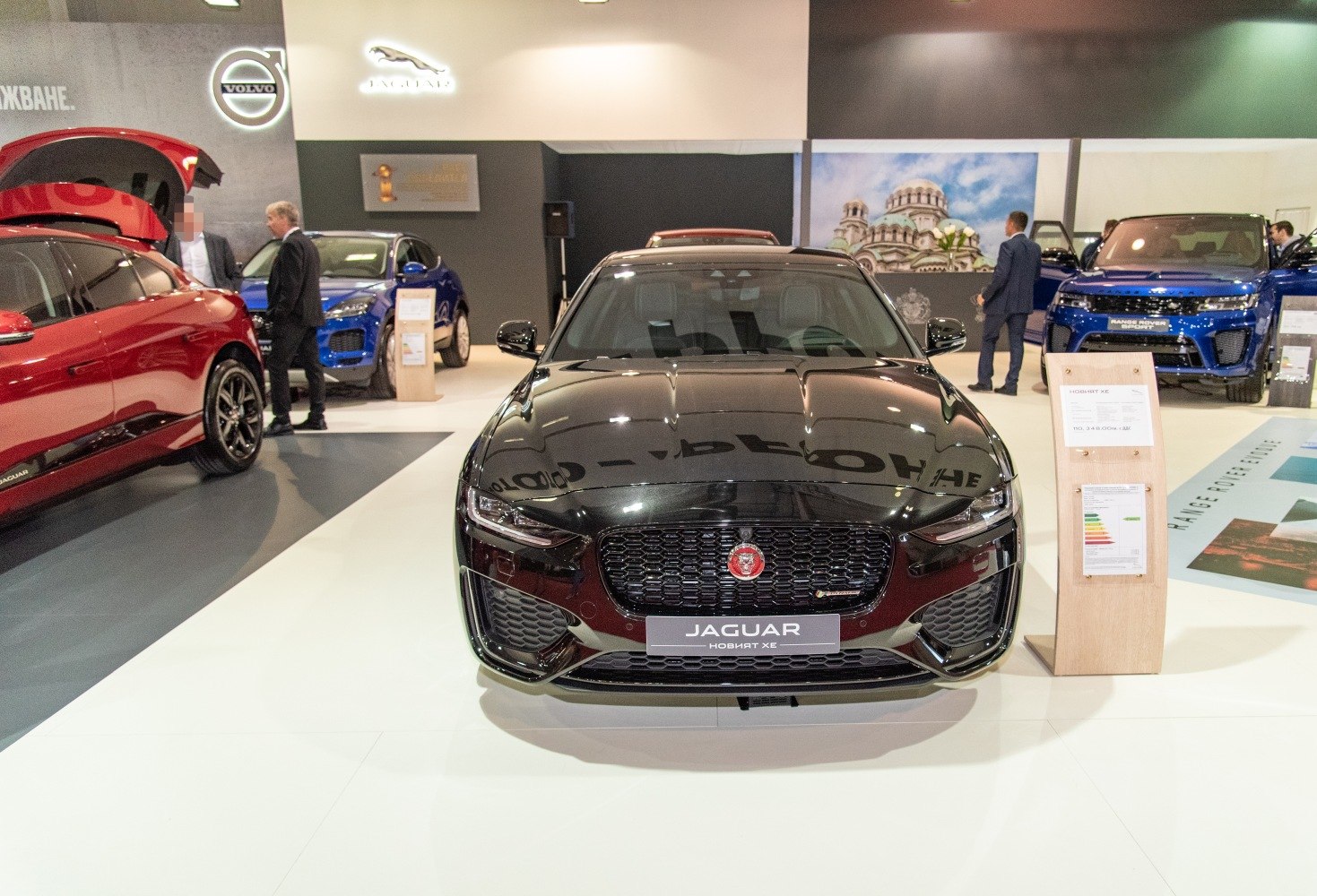 Front grille and headlights of a sleek black luxury sedan