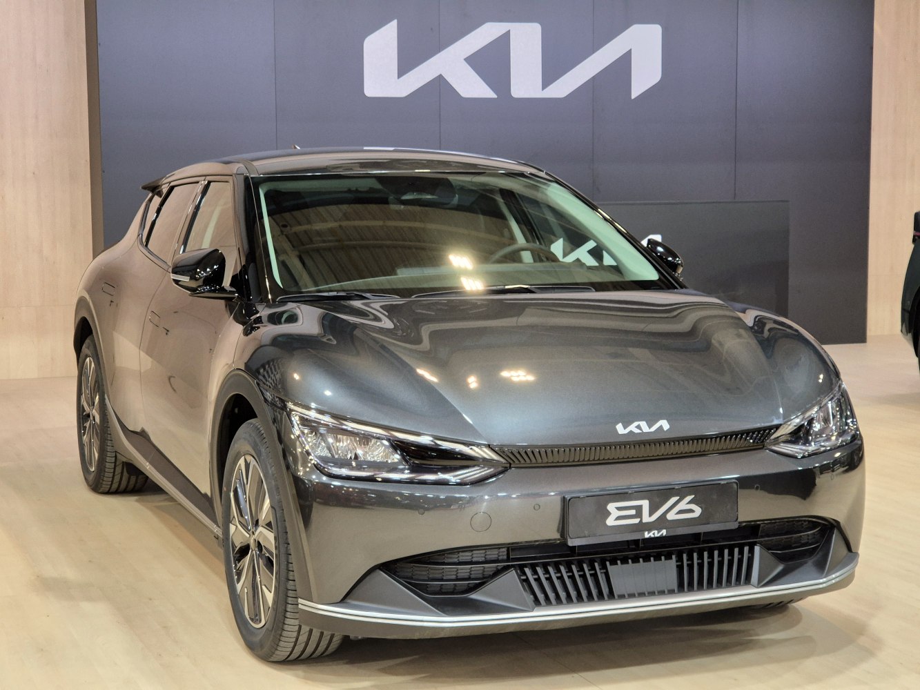 Front view of electric SUV with modern headlights and aerodynamic design