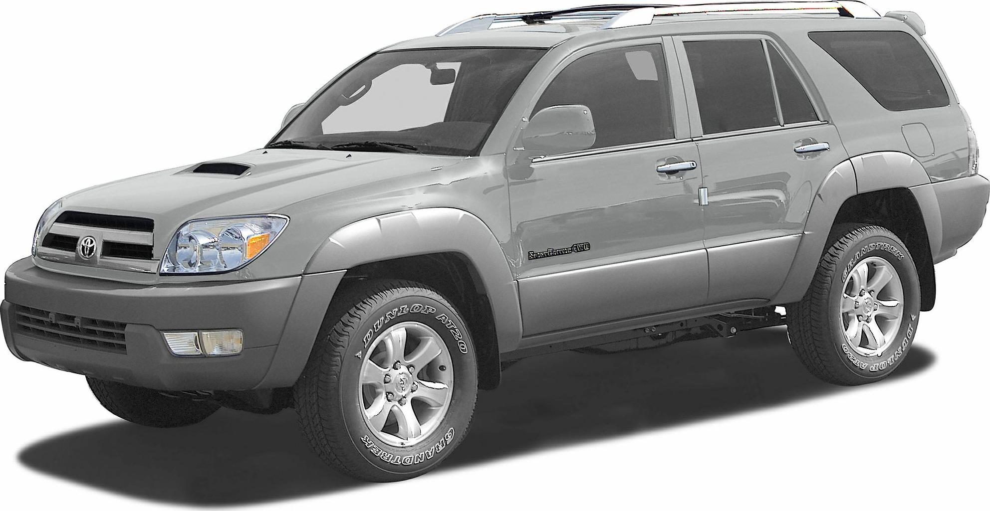 Side and front view of rugged mid-2000s SUV with roof rails and off-road tires