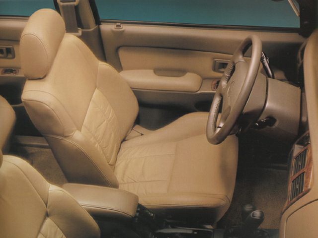 Beige leather driver seat and dashboard interior