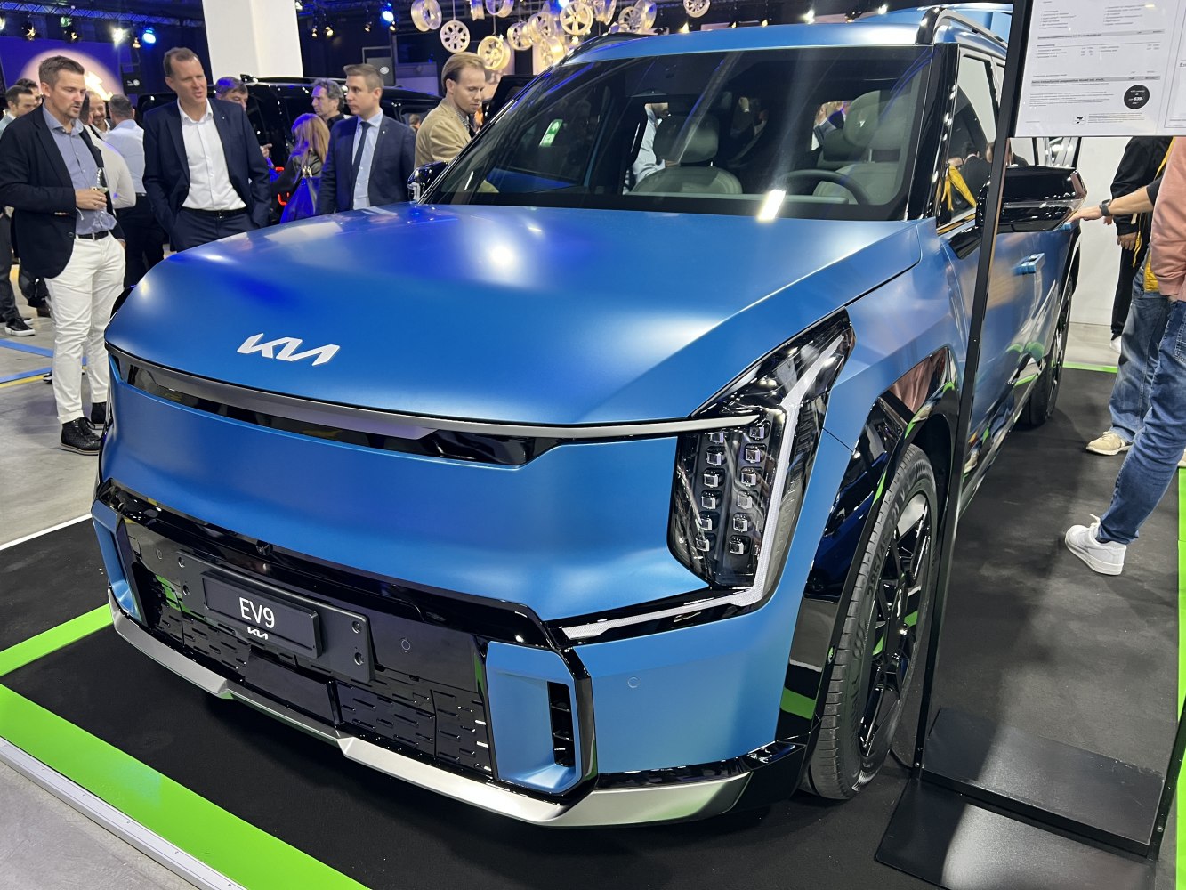 Electric SUV front fascia with vertical LED headlights and bold design elements, metallic blue finish.