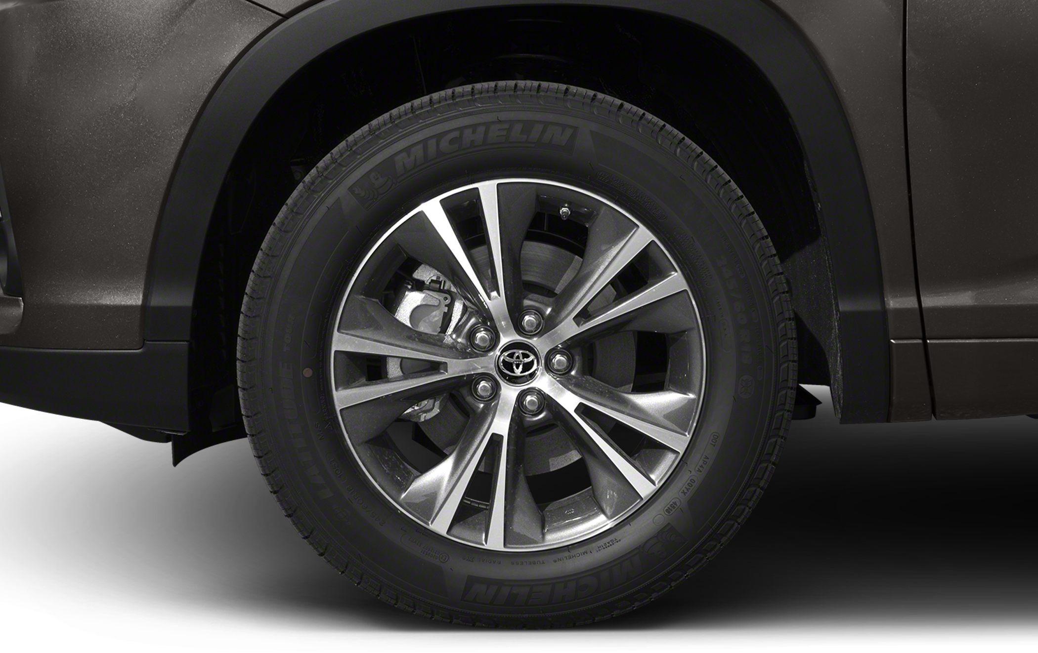 Alloy wheel and Michelin tire with visible brake caliper and disc