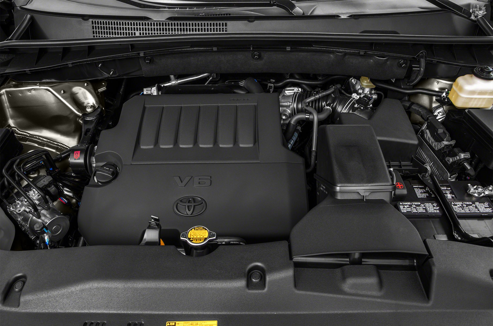 V6 engine compartment with Toyota emblem and components