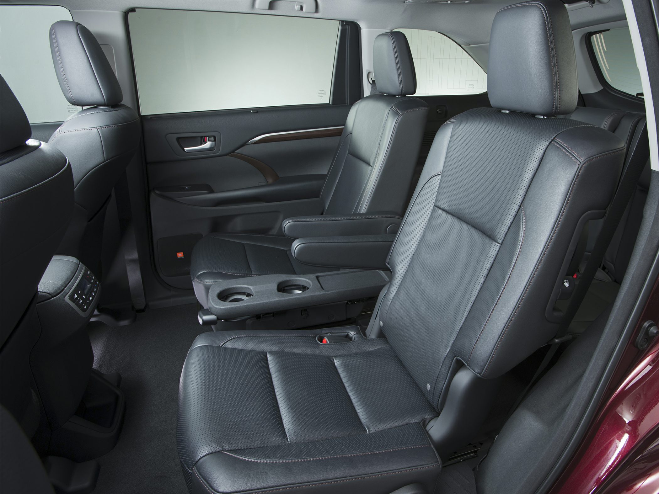 Black leather captain seats with armrests in second-row interior