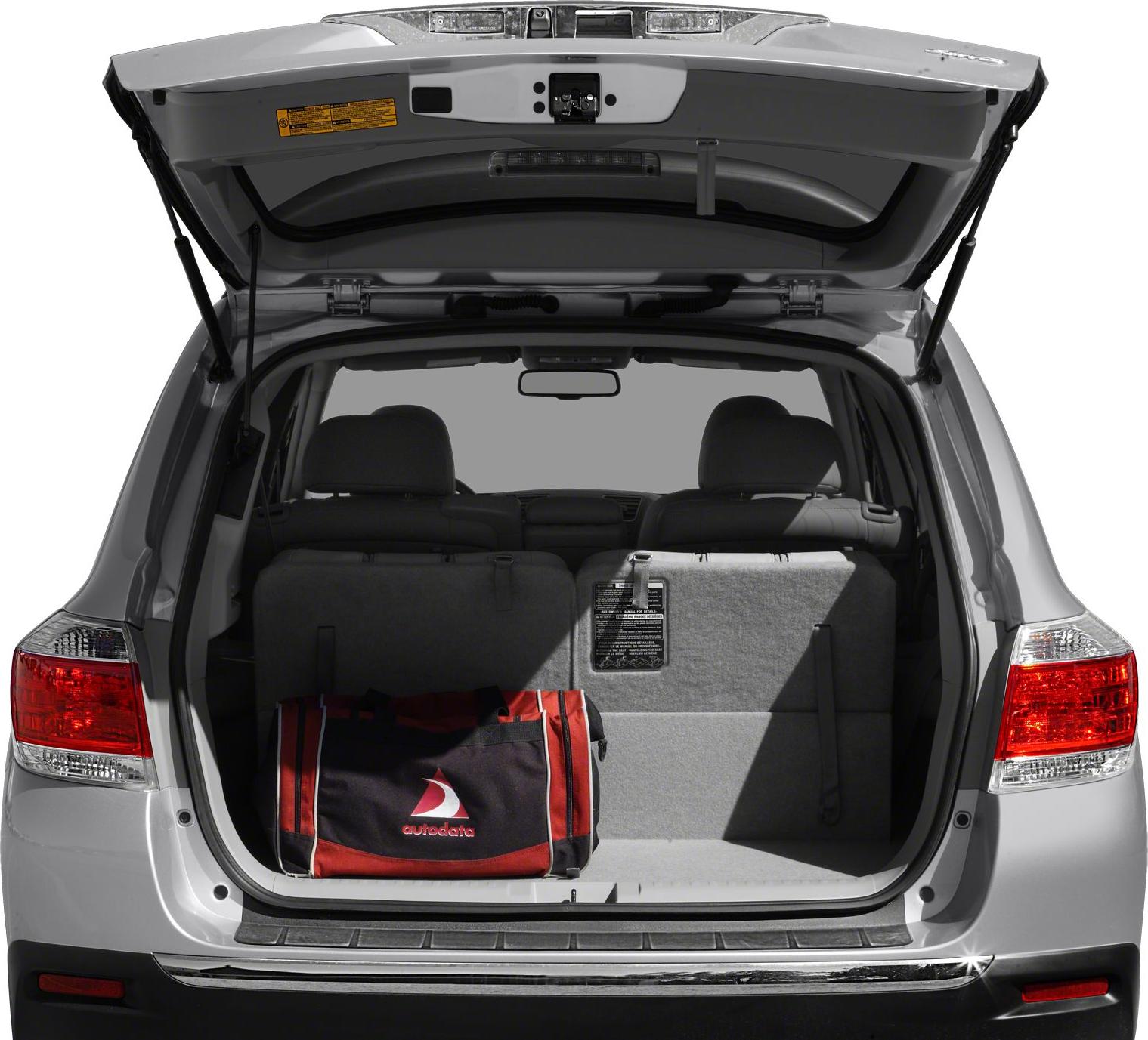 Open rear cargo area with split folding seats and open tailgate