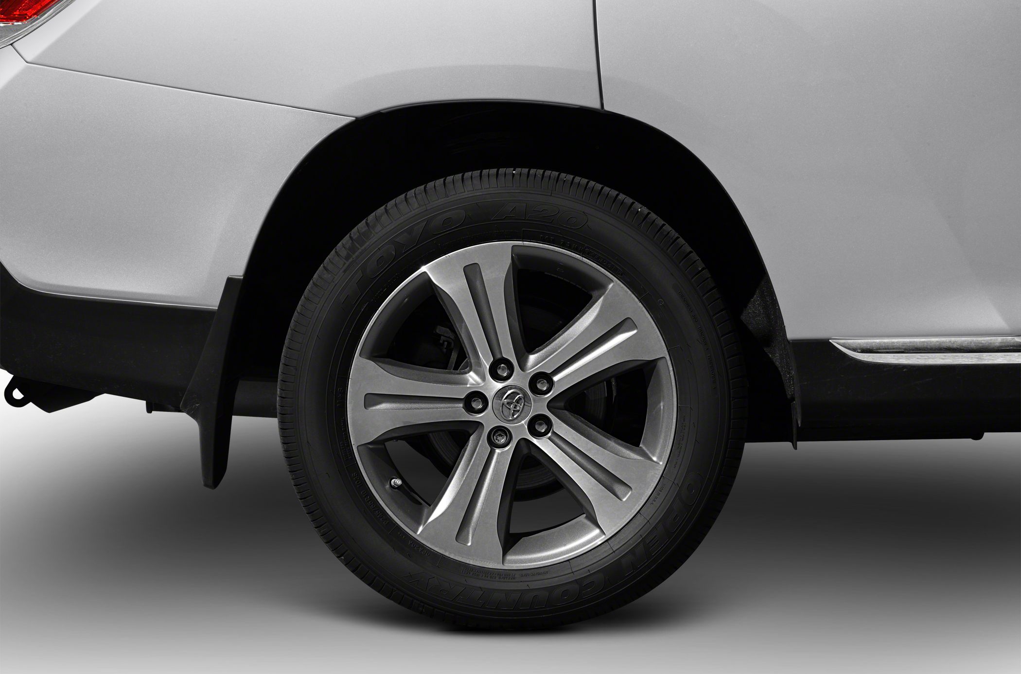 Close-up of alloy wheel and rear fender with tire