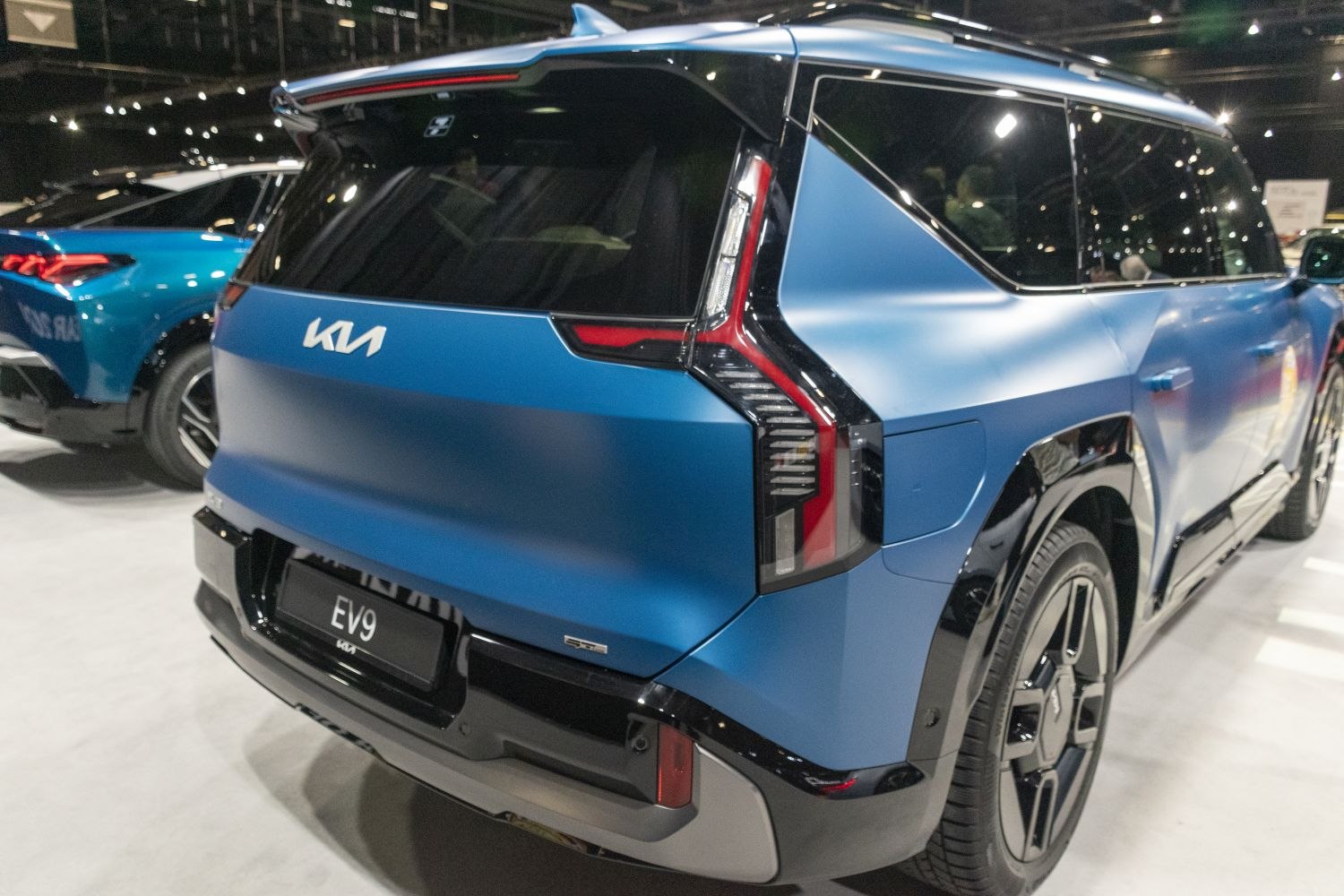 Close-up of rear design with distinctive tail lights and matte blue finish