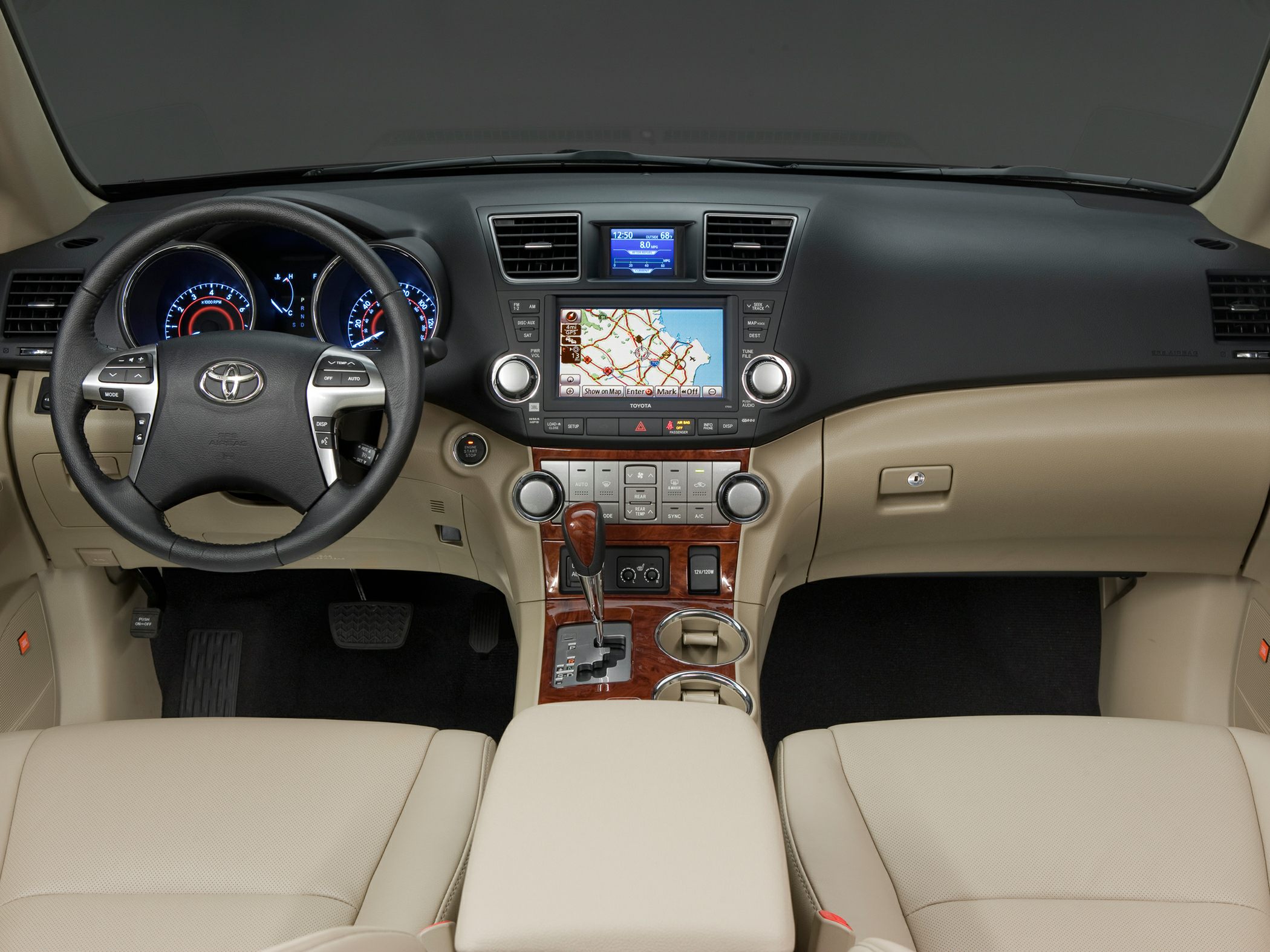 Dashboard with navigation screen, climate controls, multifunction steering wheel