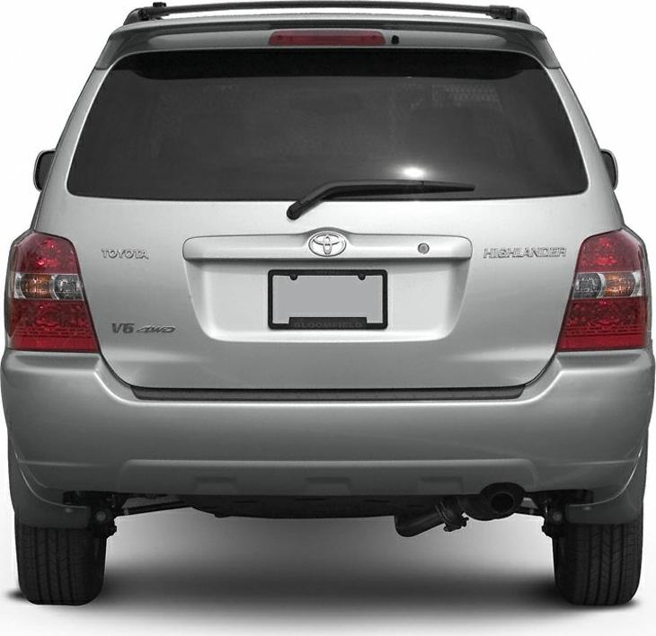 Rear view with badges, windshield wiper, taillights, and roof rack