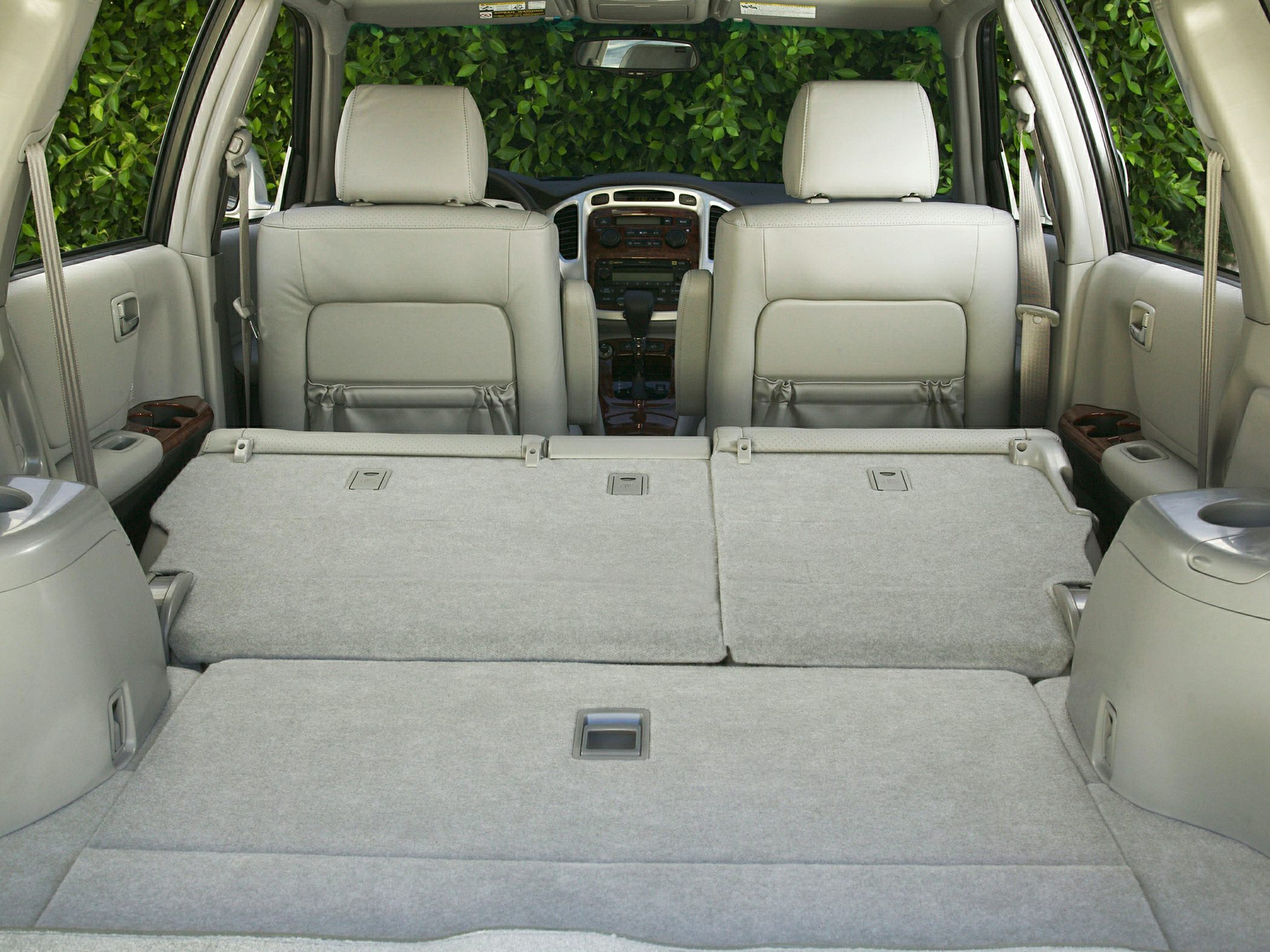 Folded rear seats with large flat cargo area in SUV interior