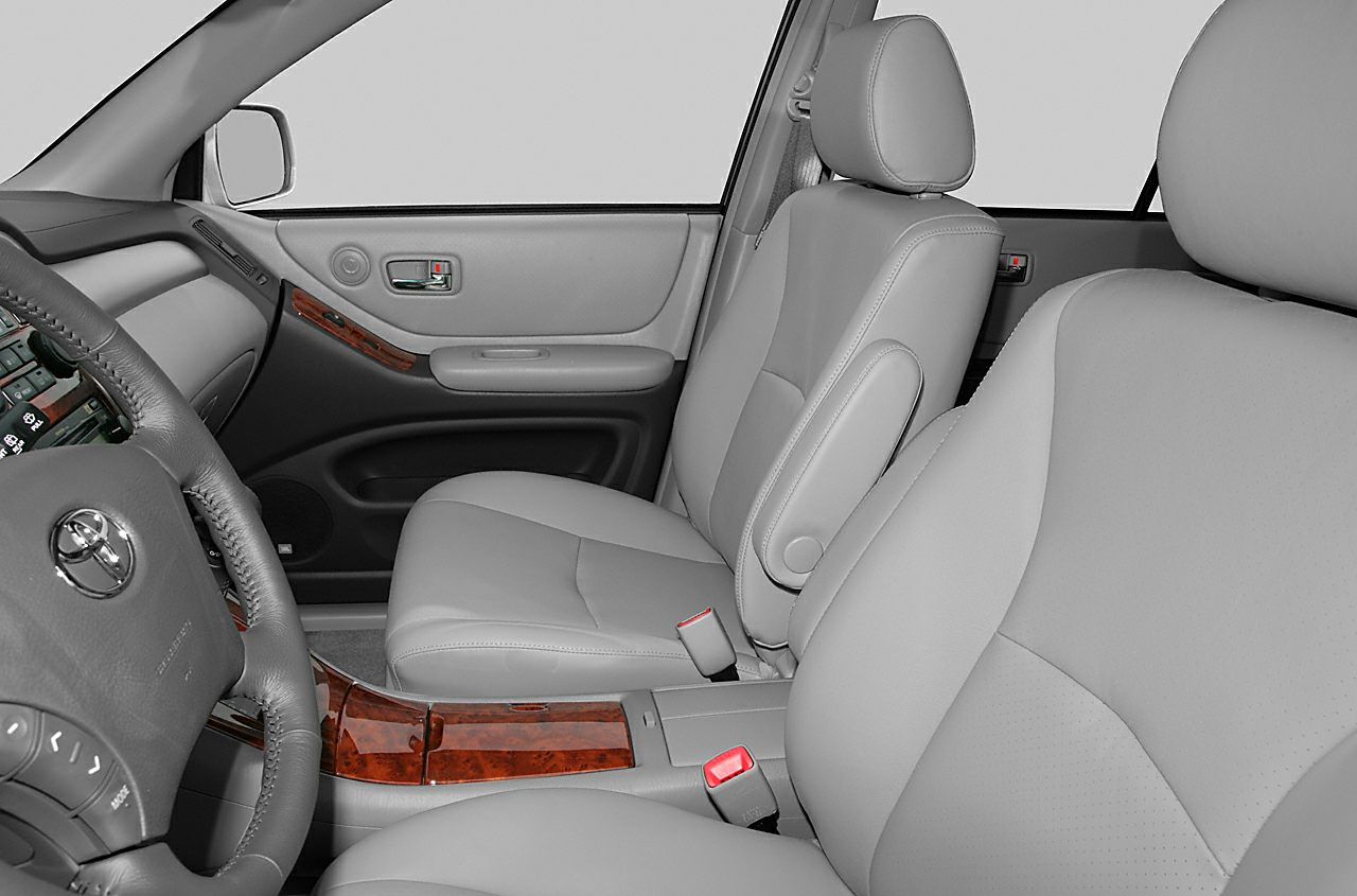 Leather seats and wood trim interior with front seats and steering wheel