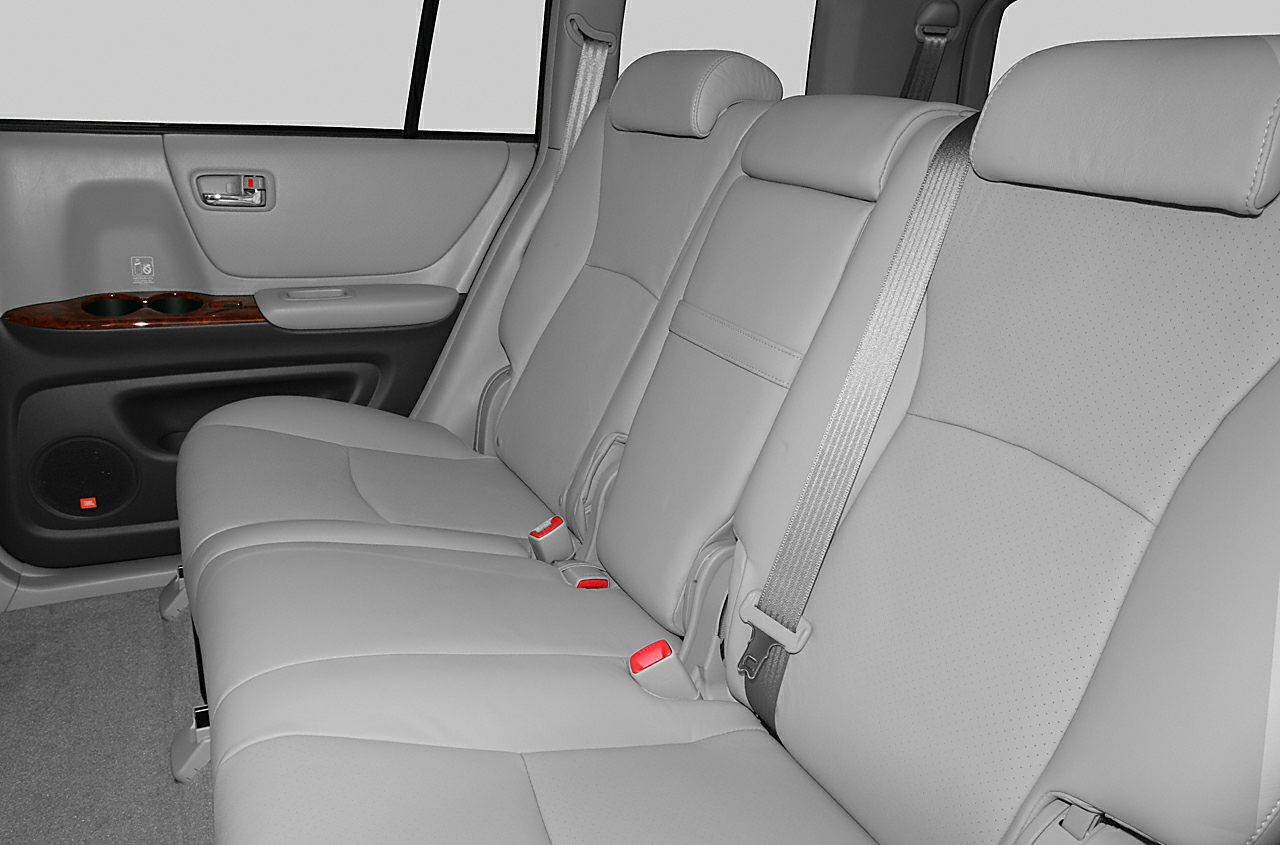 Rear seat interior with leather upholstery and safety belts