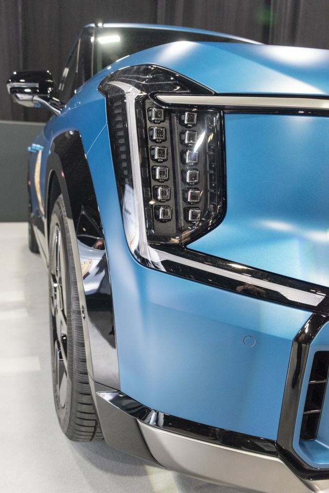 LED headlight and front fender close-up on blue SUV