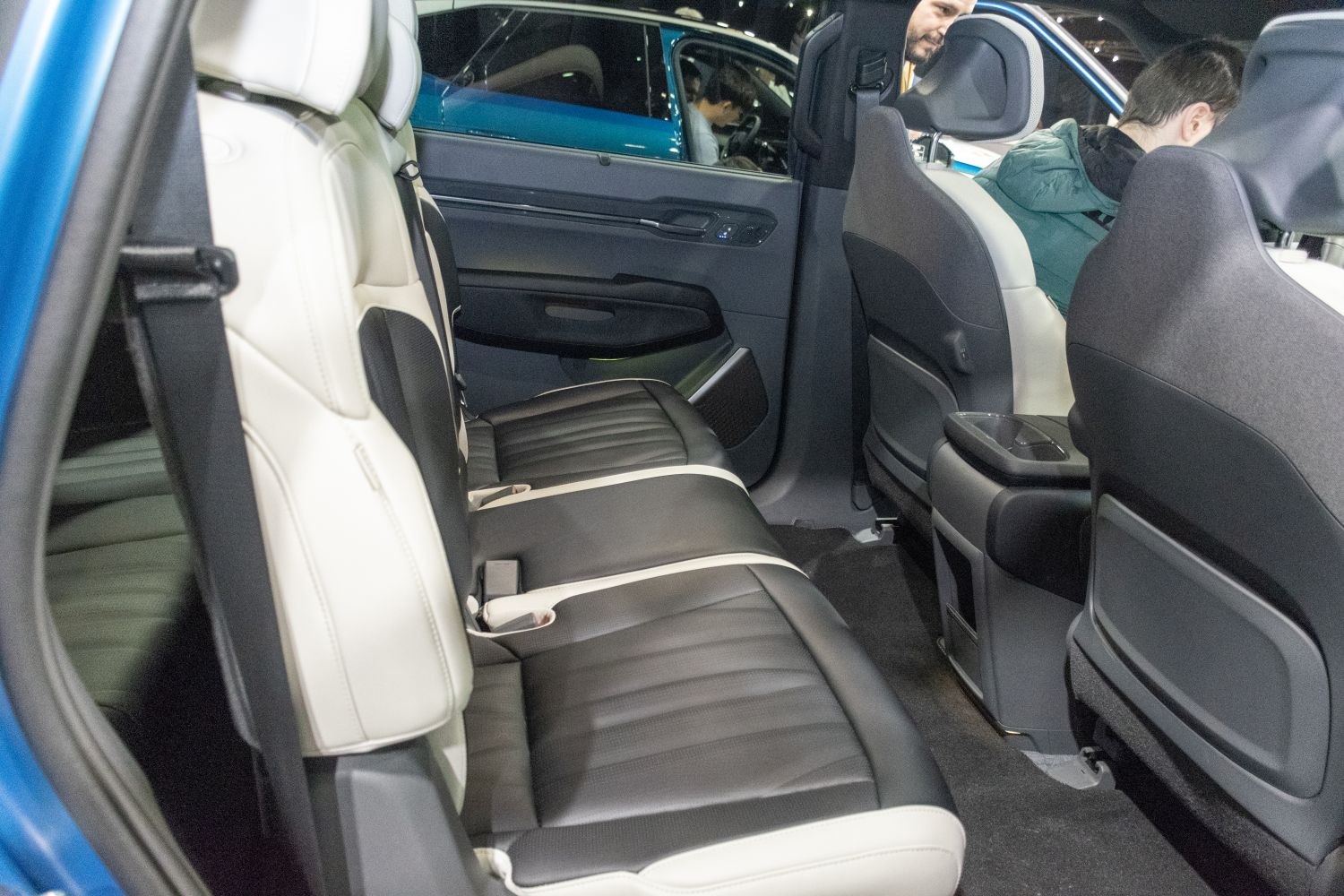 Spacious rear seat with black and white leather upholstery