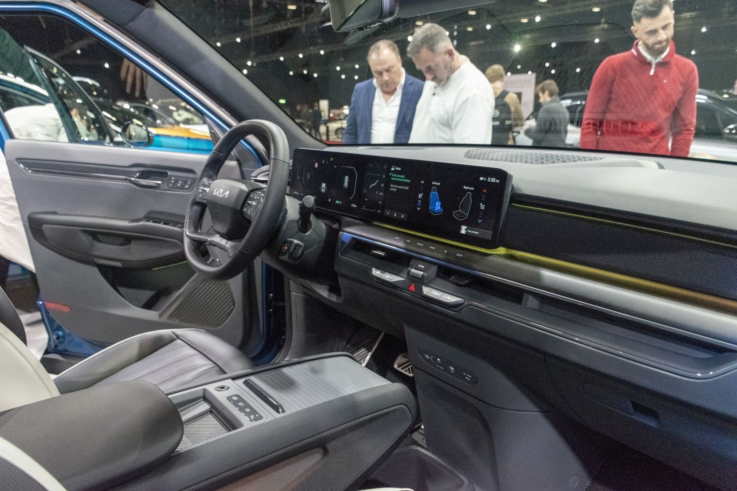 Widescreen digital dashboard and modern steering wheel controls.