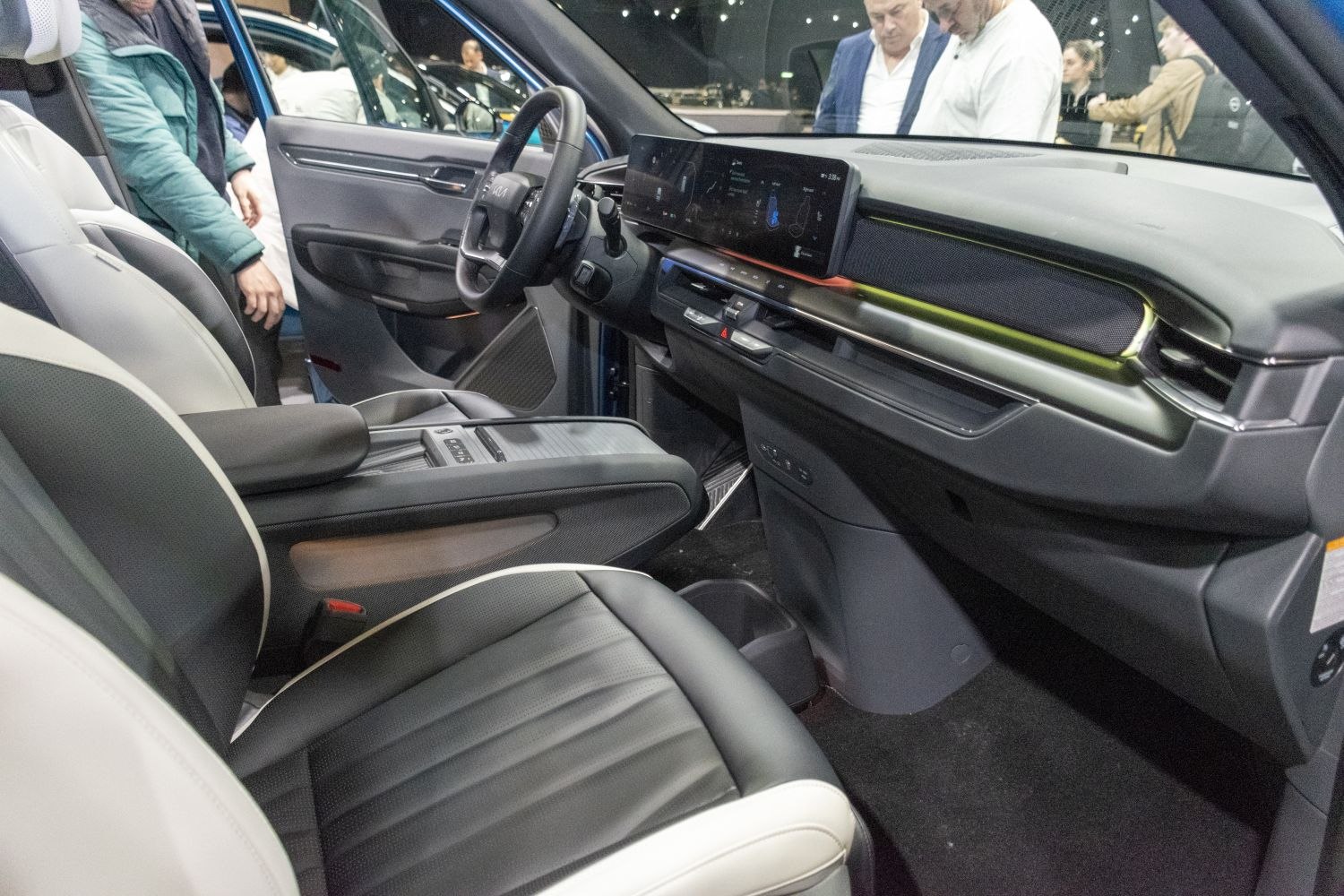 Digital dashboard and premium multi-tone leather seats in an electric SUV interior.