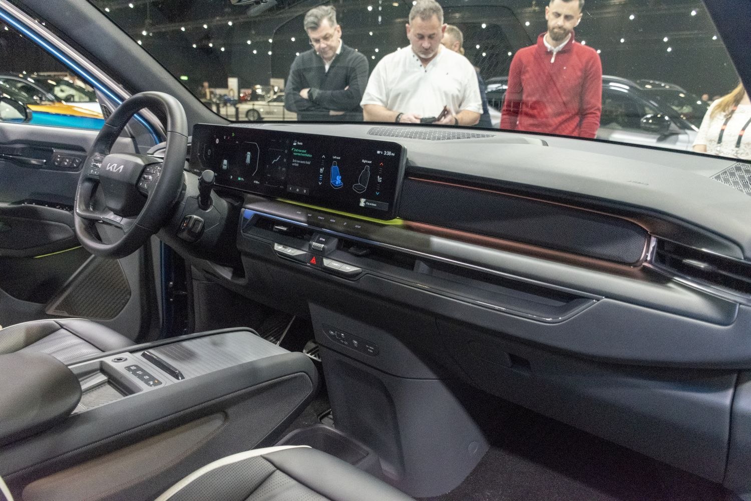 Modern electric SUV interior with wide digital display and smart controls