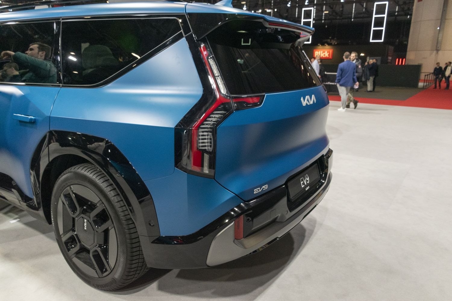 Rear close-up of angular taillight and wheel of a modern electric SUV