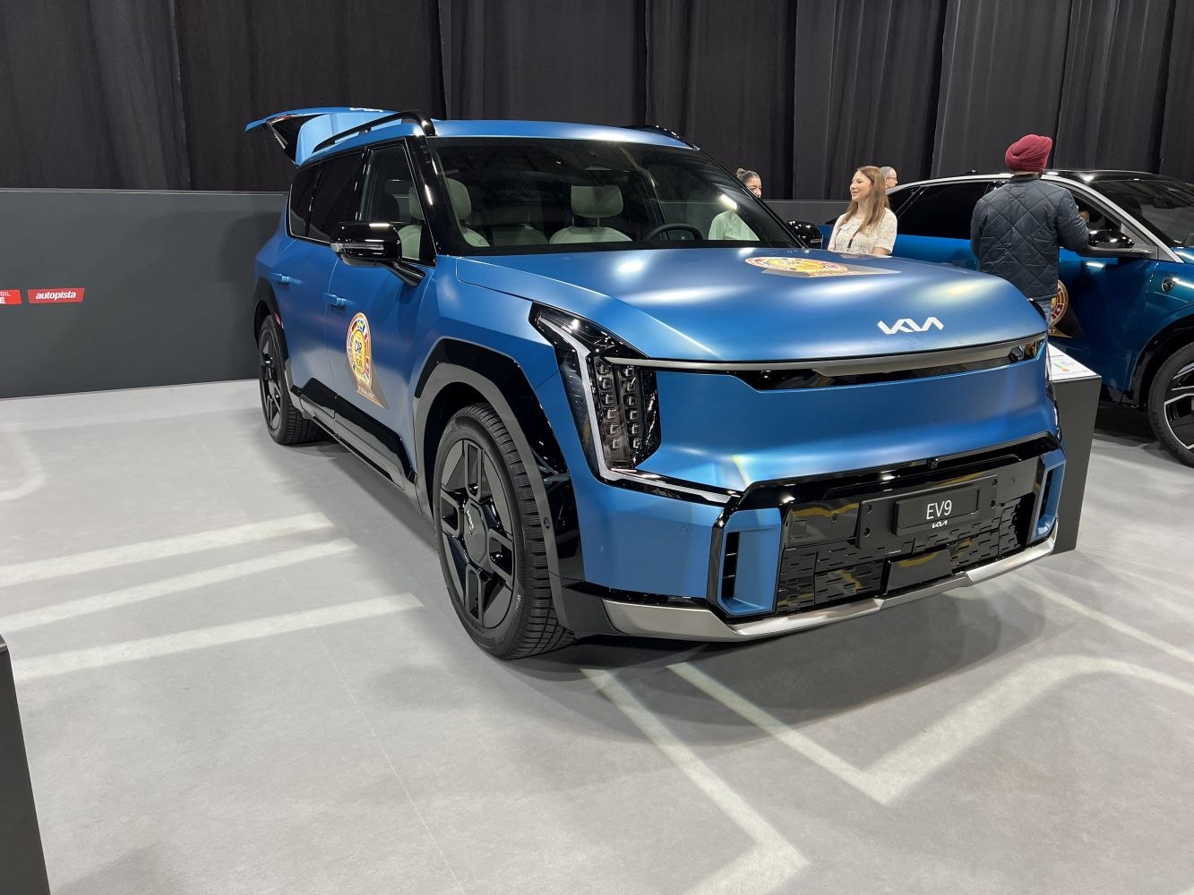 Electric SUV front with sharp LED headlights and bold angular design