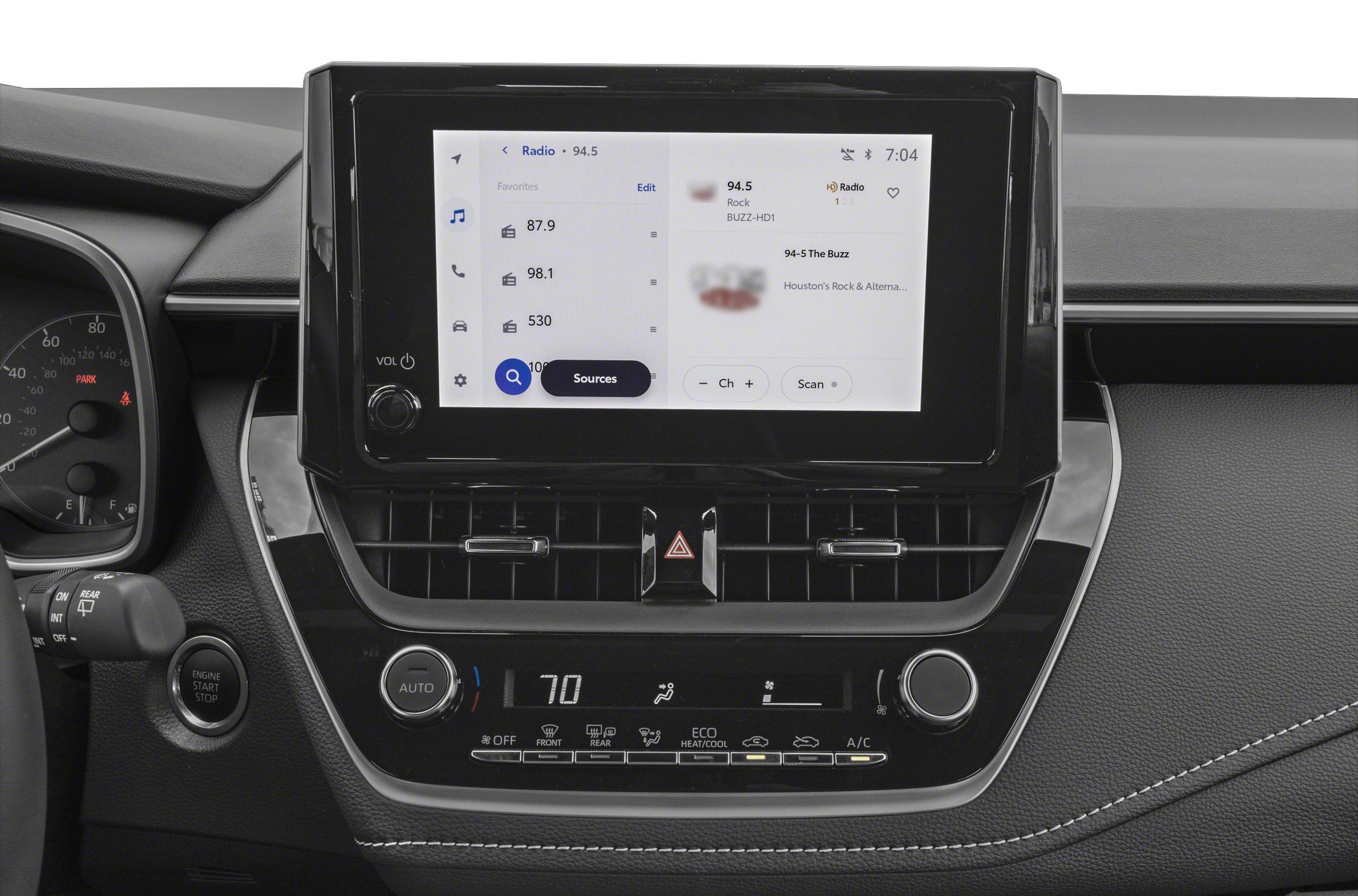 Touchscreen infotainment and climate control panel in modern car interior