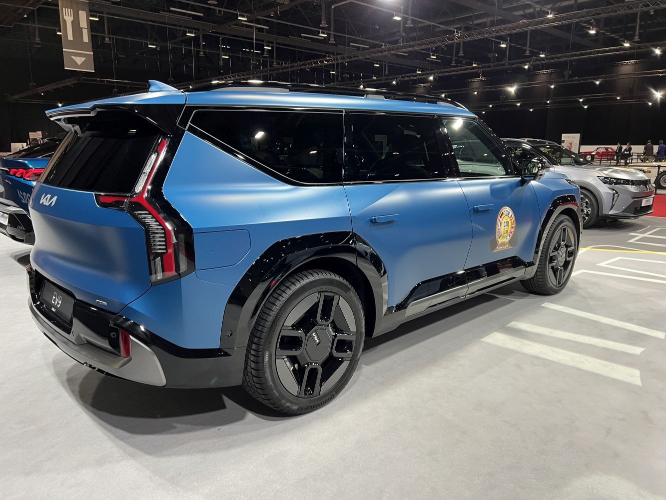 Rear and side view of an electric SUV with unique rear light design and modern styling.