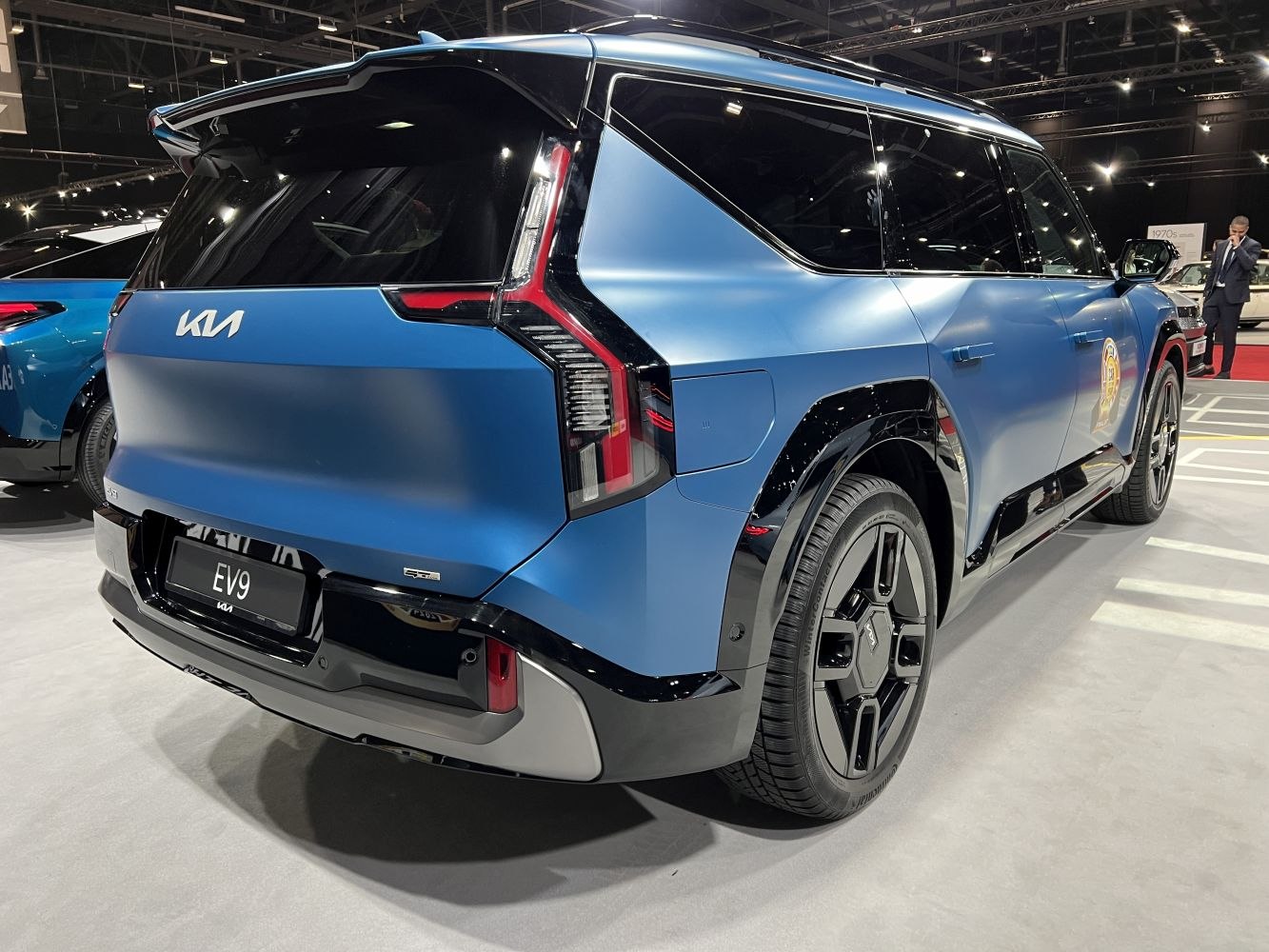 Sleek rear design and distinctive vertical tail lights on an electric SUV.