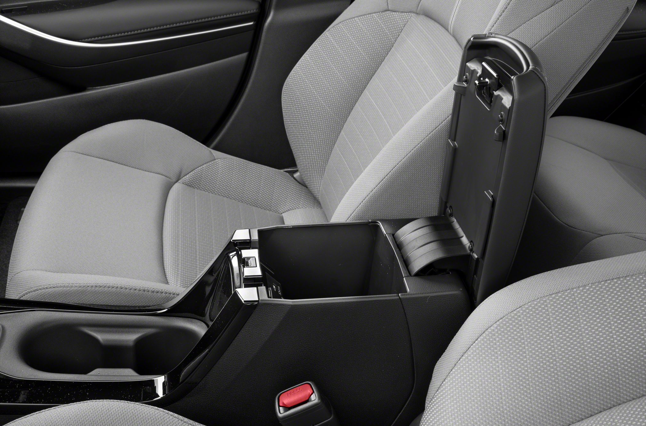 Center console storage compartment and cup holders with fabric seats