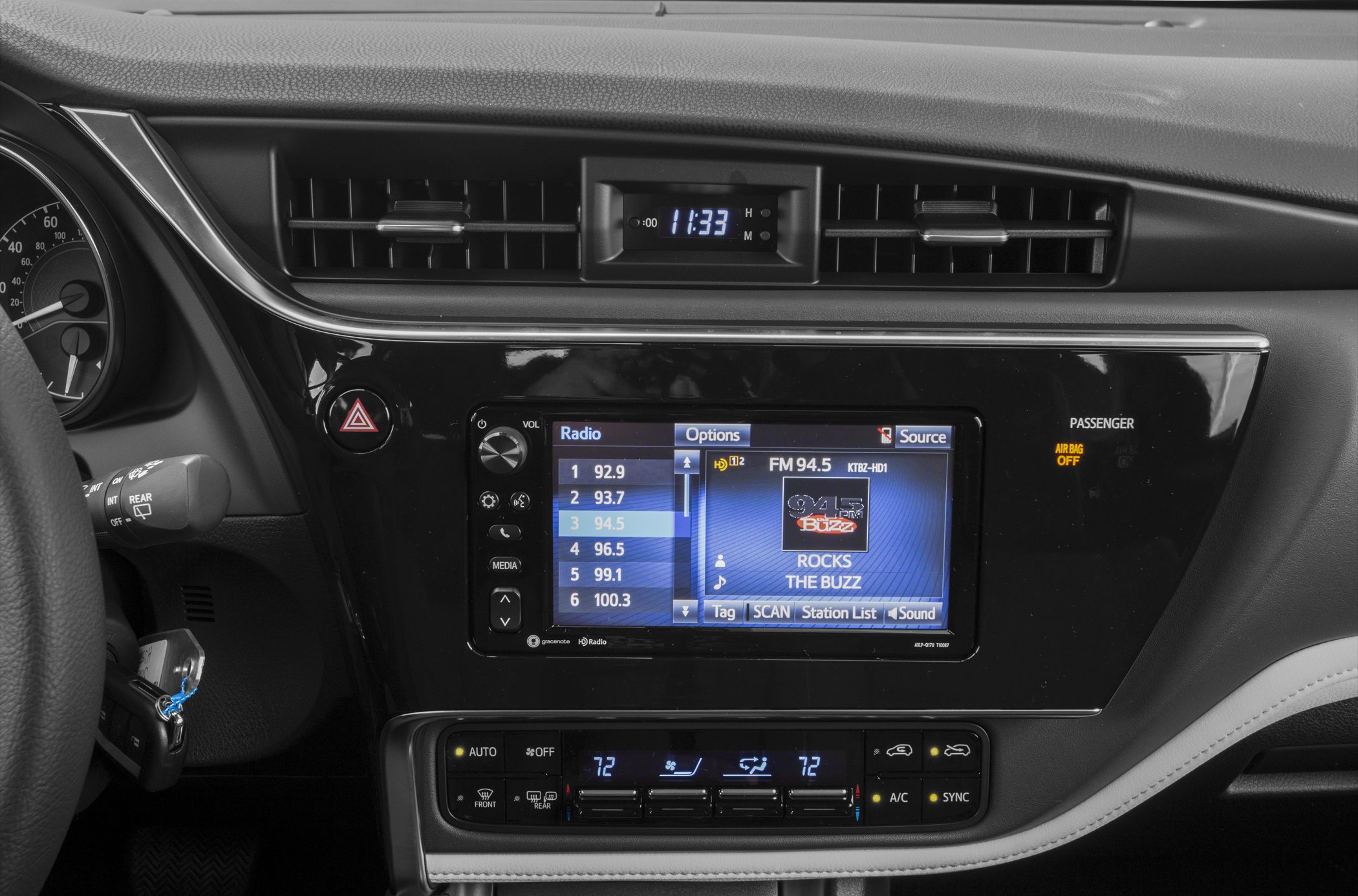 Dashboard with digital clock, infotainment system, dual-zone climate controls