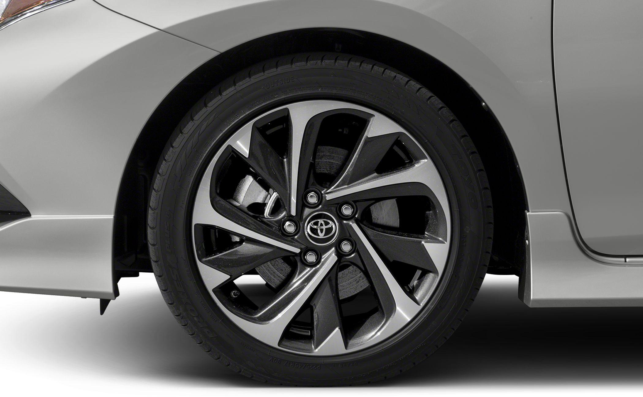 Alloy wheel rim and tire close-up with stylish geometric pattern