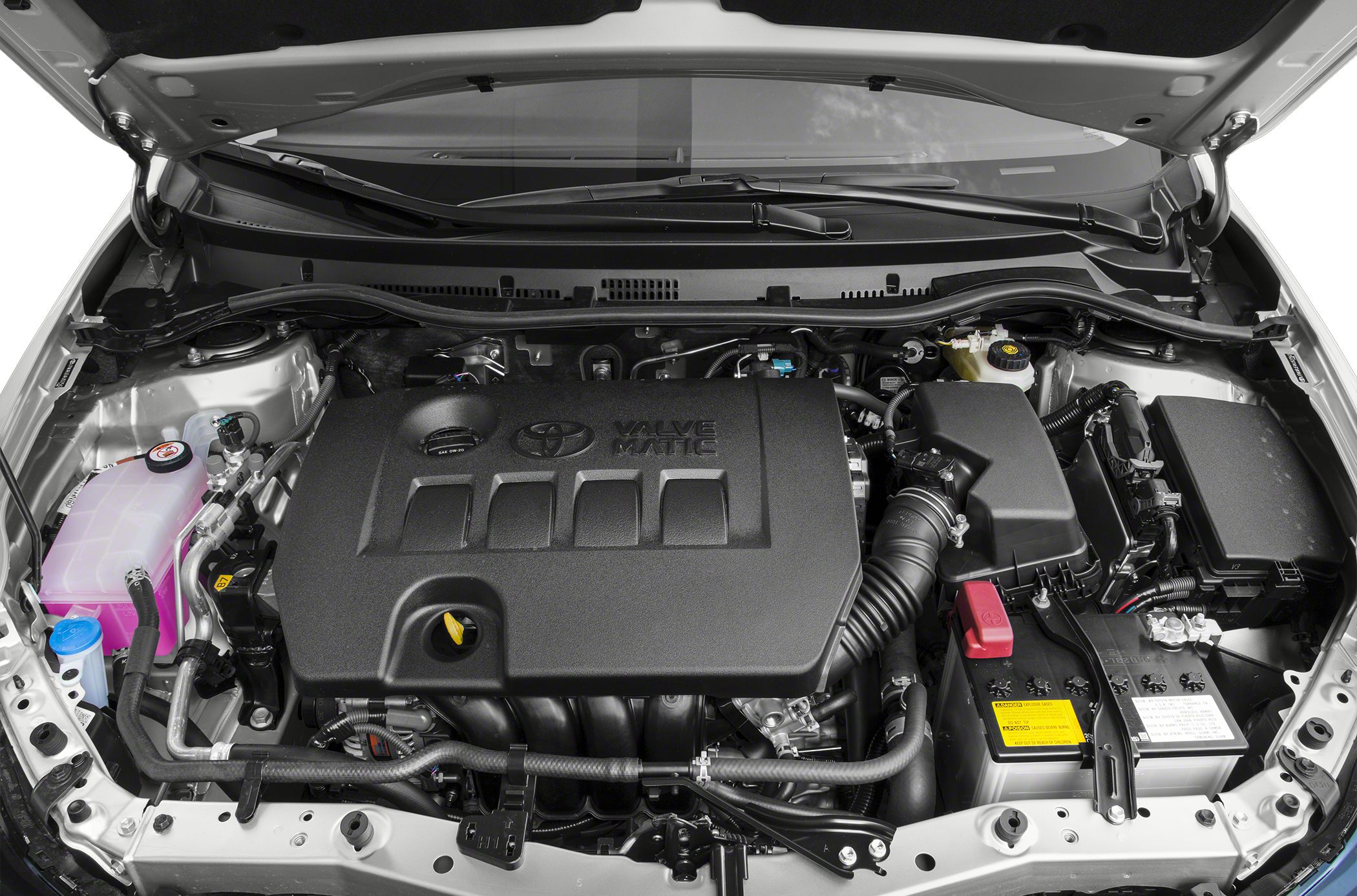 Valvematic engine cover with battery, air intake, and fluid reservoirs.