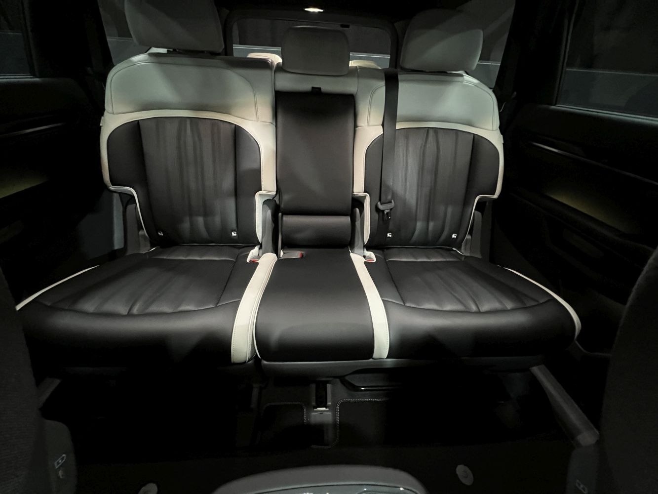 Black and white leather rear seats with seatbelt