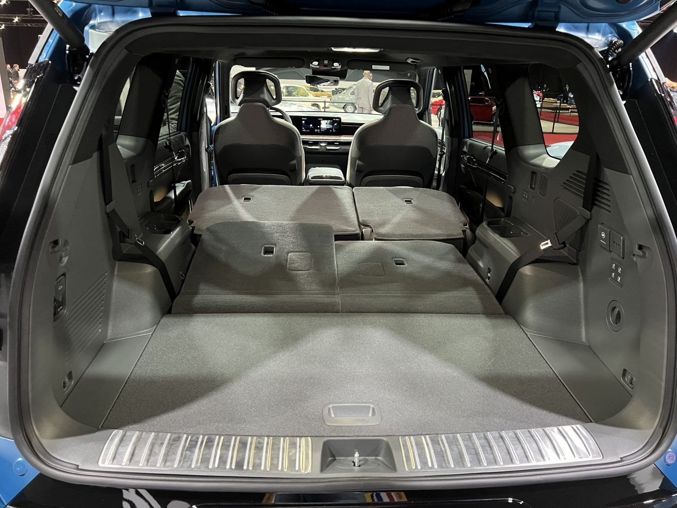 Fold-flat rear seats and large cargo space of an SUV interior