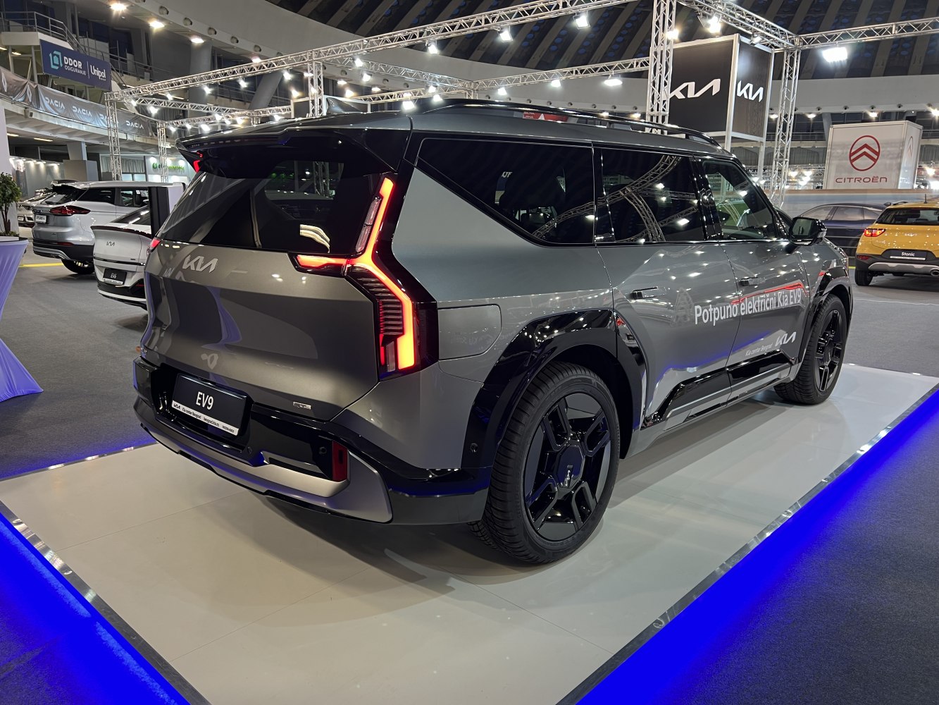 Modern electric SUV rear with distinctive angular LED tail lights and sleek wheels.