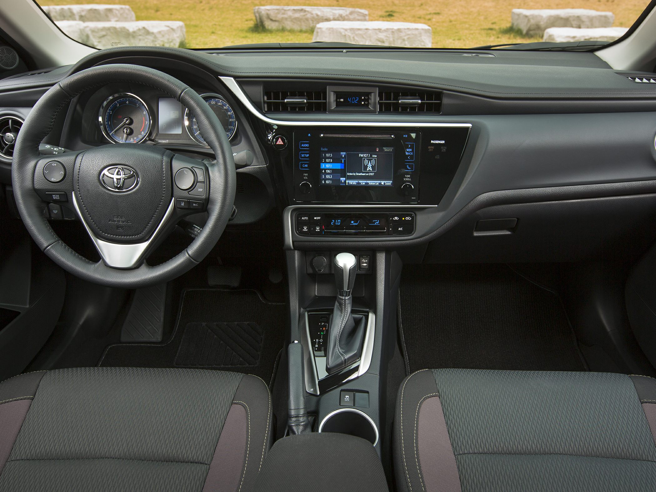 Dashboard with infotainment screen and multifunction steering wheel