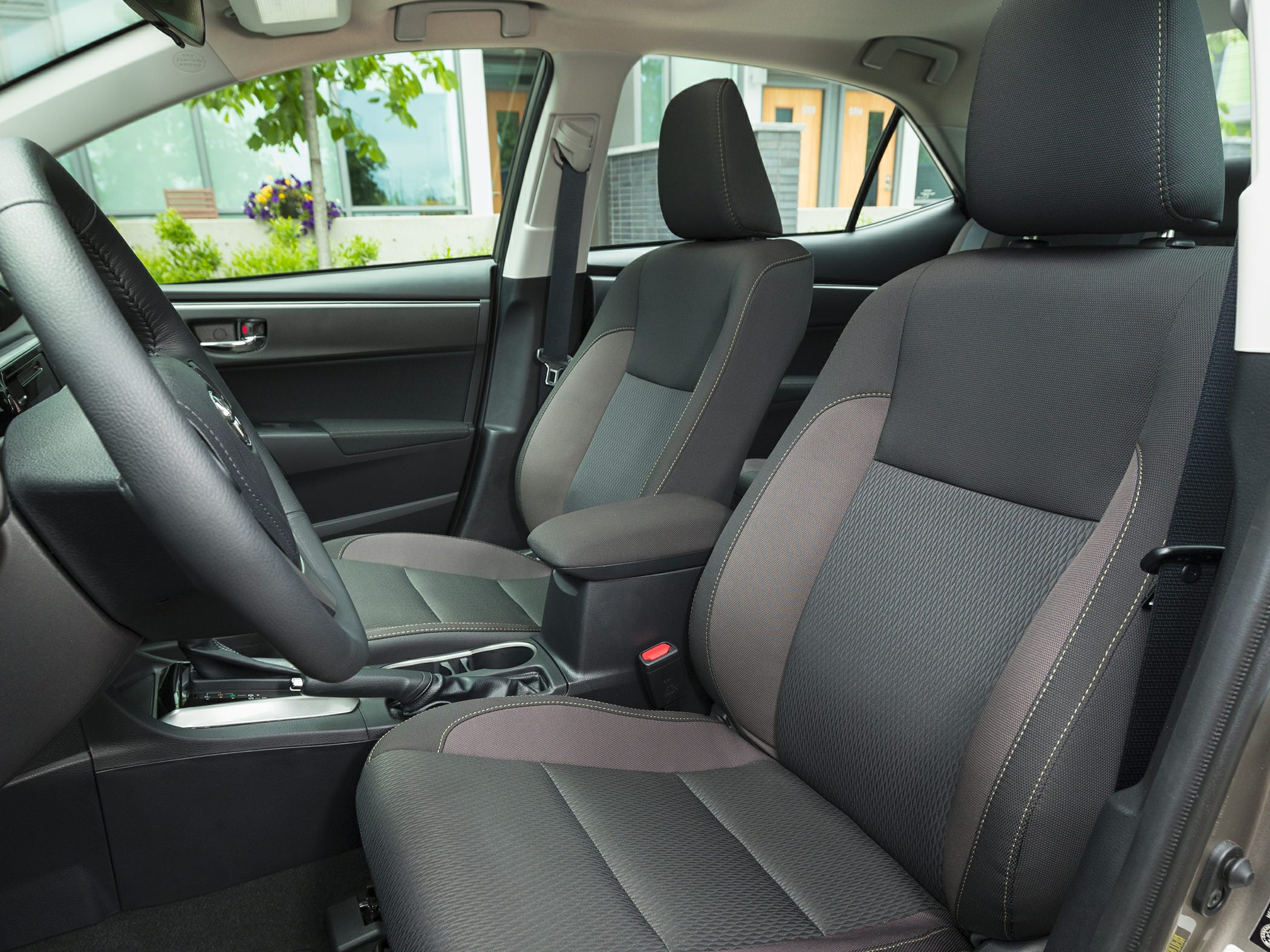 Front seats and cabin interior with steering wheel and dashboard
