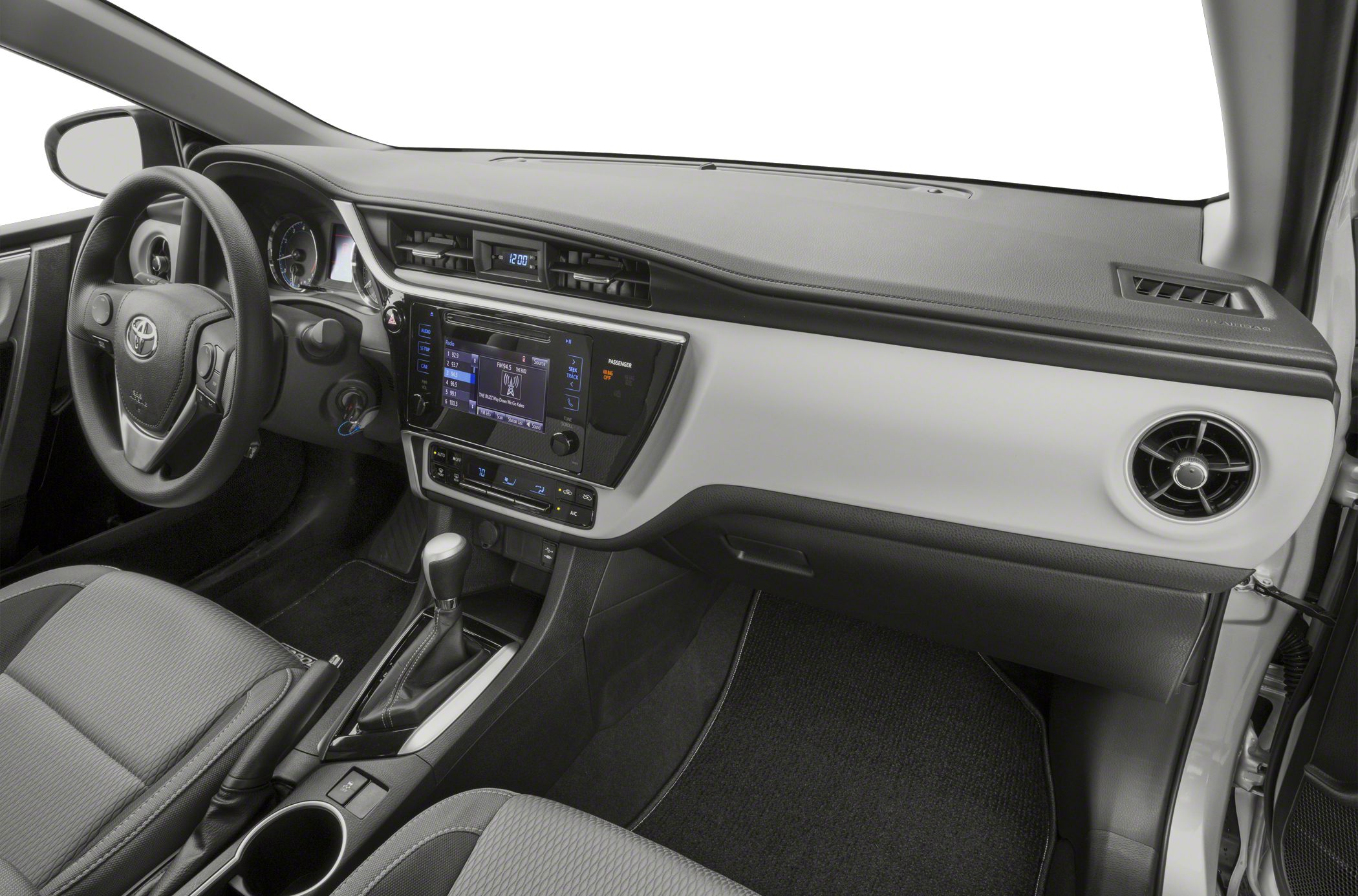 Modern dashboard and center console with touchscreen and circular air vents