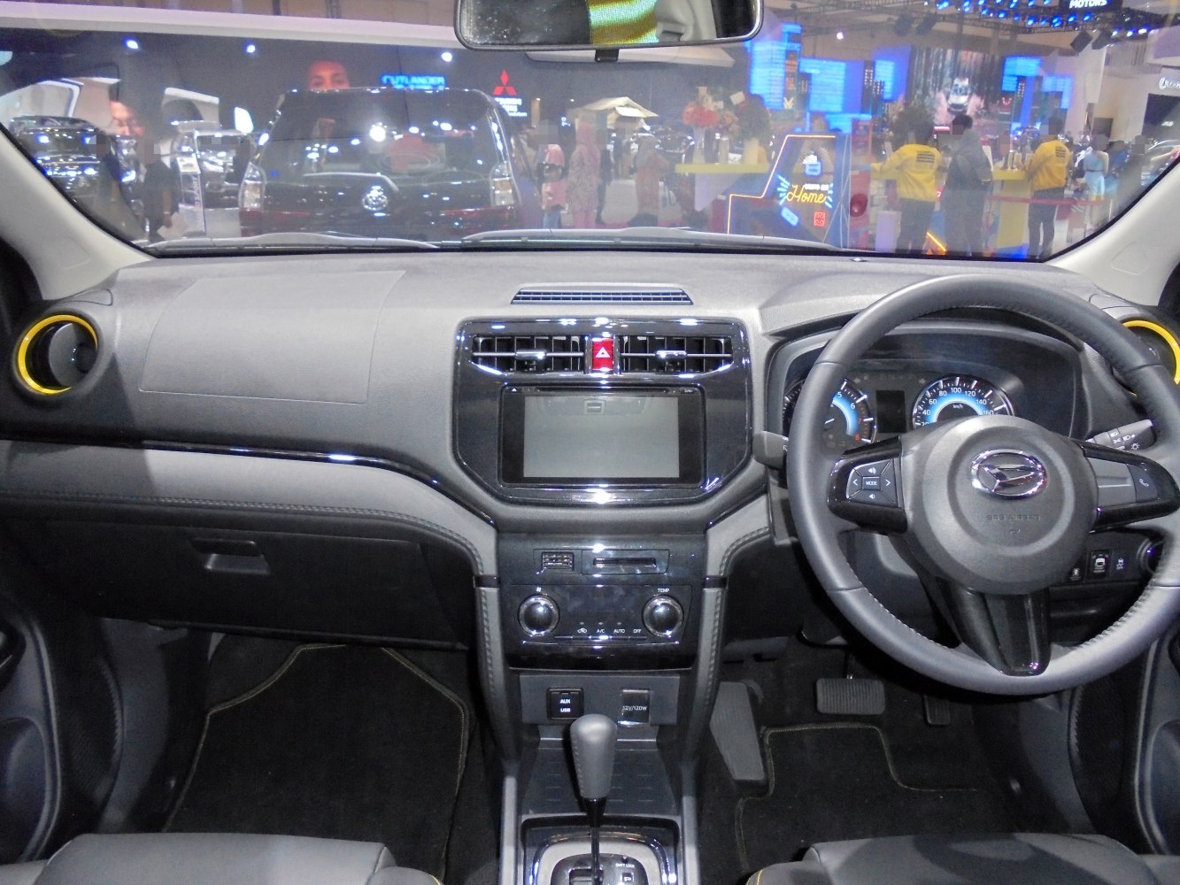 Dashboard and steering wheel with central display and controls