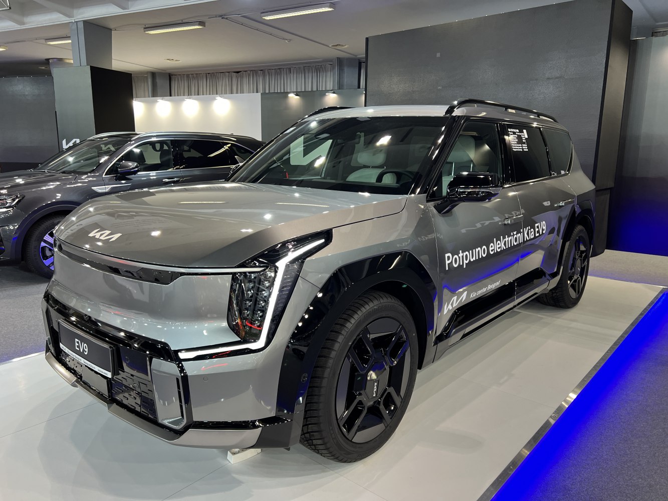 Futuristic LED headlights and sleek alloy wheels on a modern electric SUV.