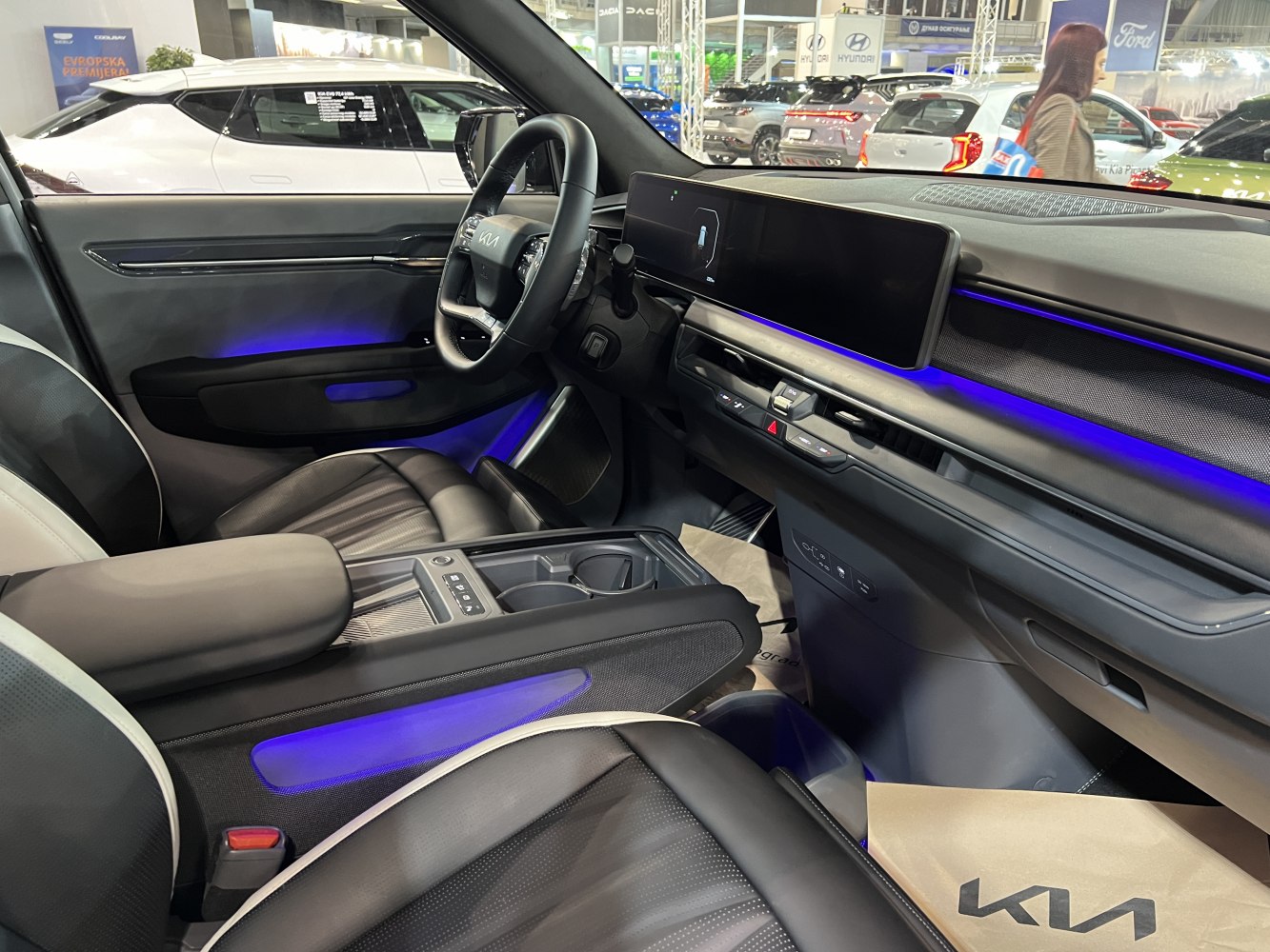 Digital dashboard and blue ambient lighting in vehicle interior