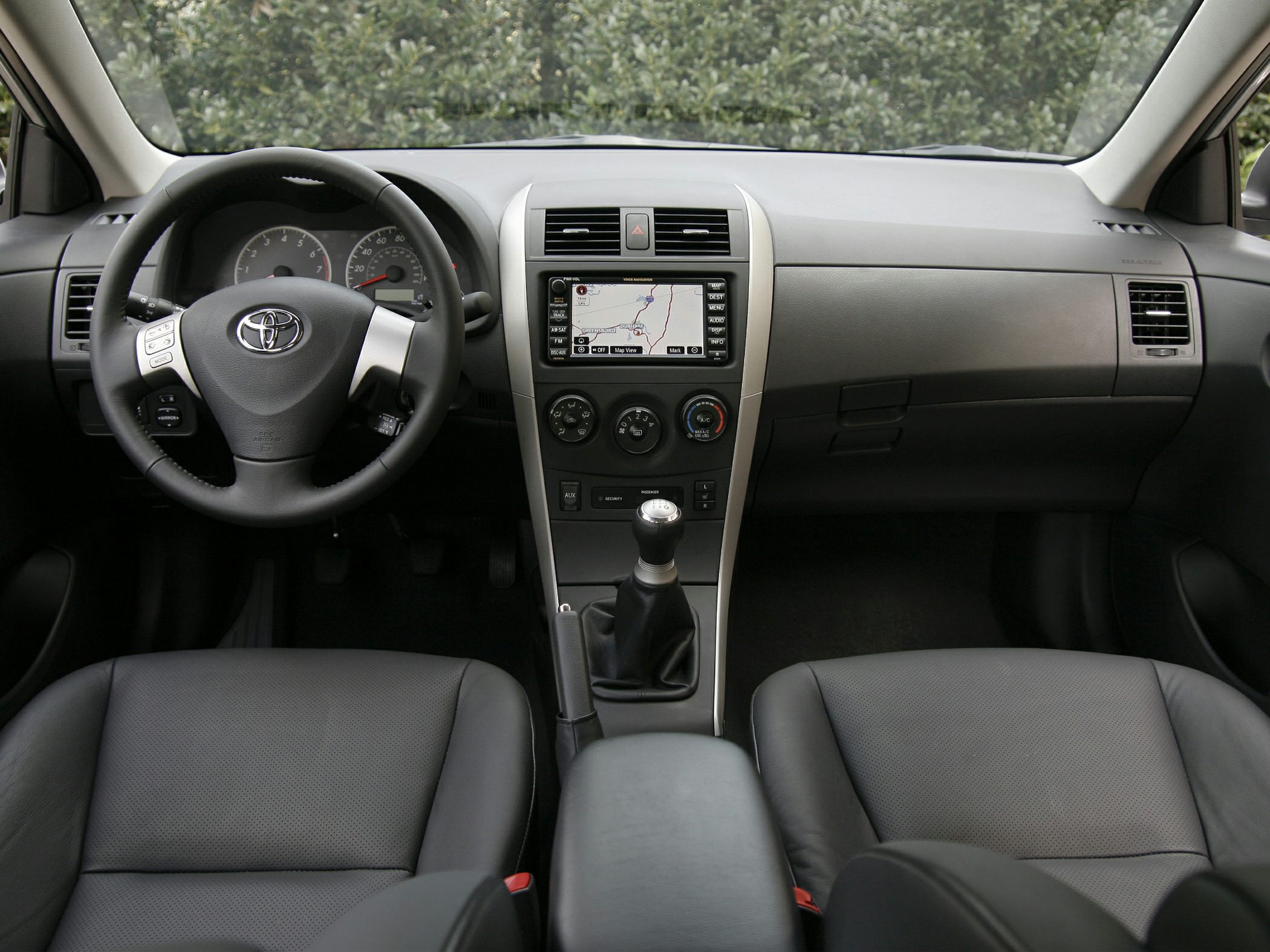 Interior dashboard with manual transmission and navigation screen